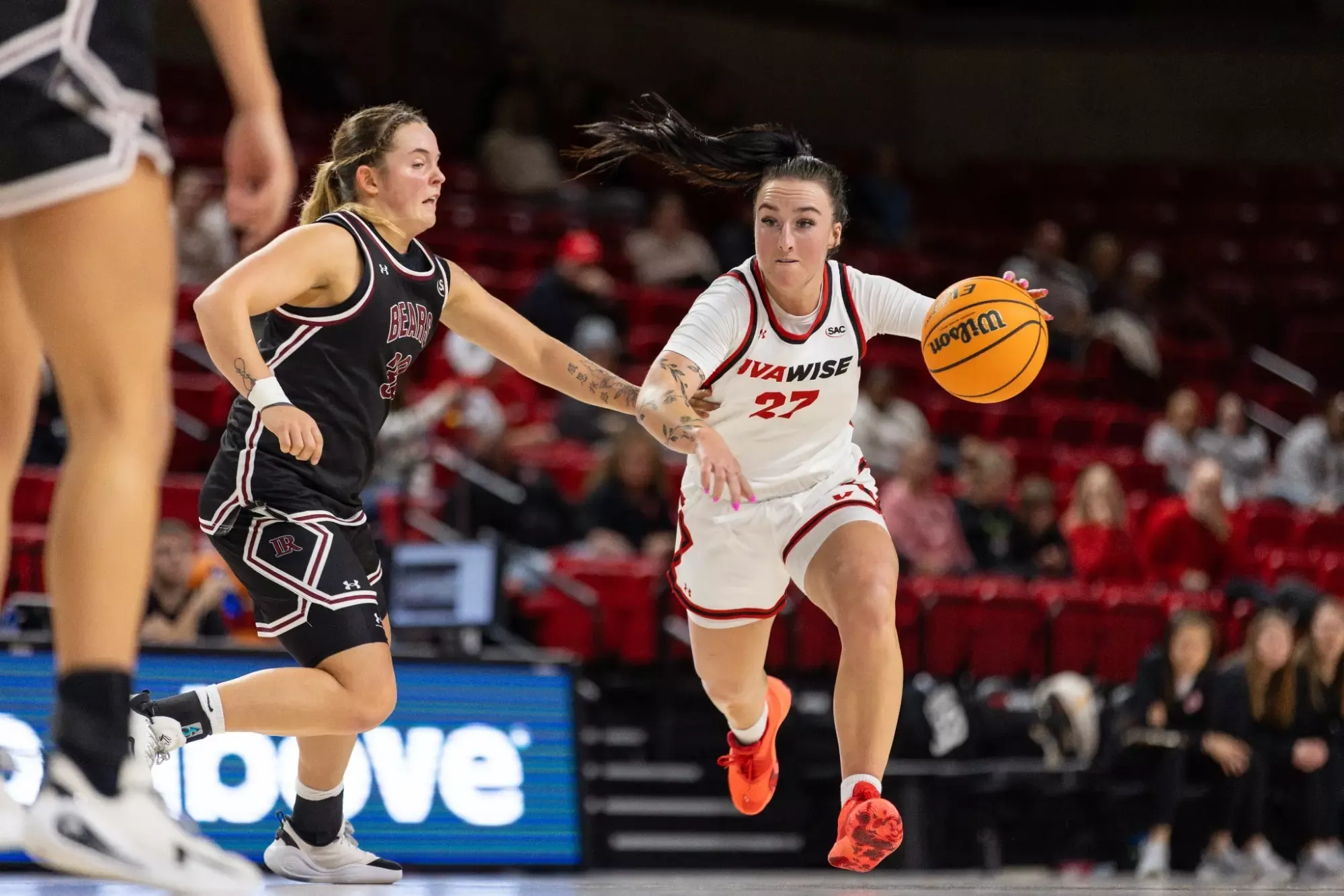 Izzy Proffitt drives past the L-R defender -- 2025-26