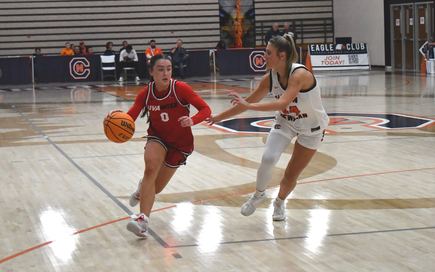 Mia Nienaber drives by C-Ns Jennifer Sullivan 2025-26