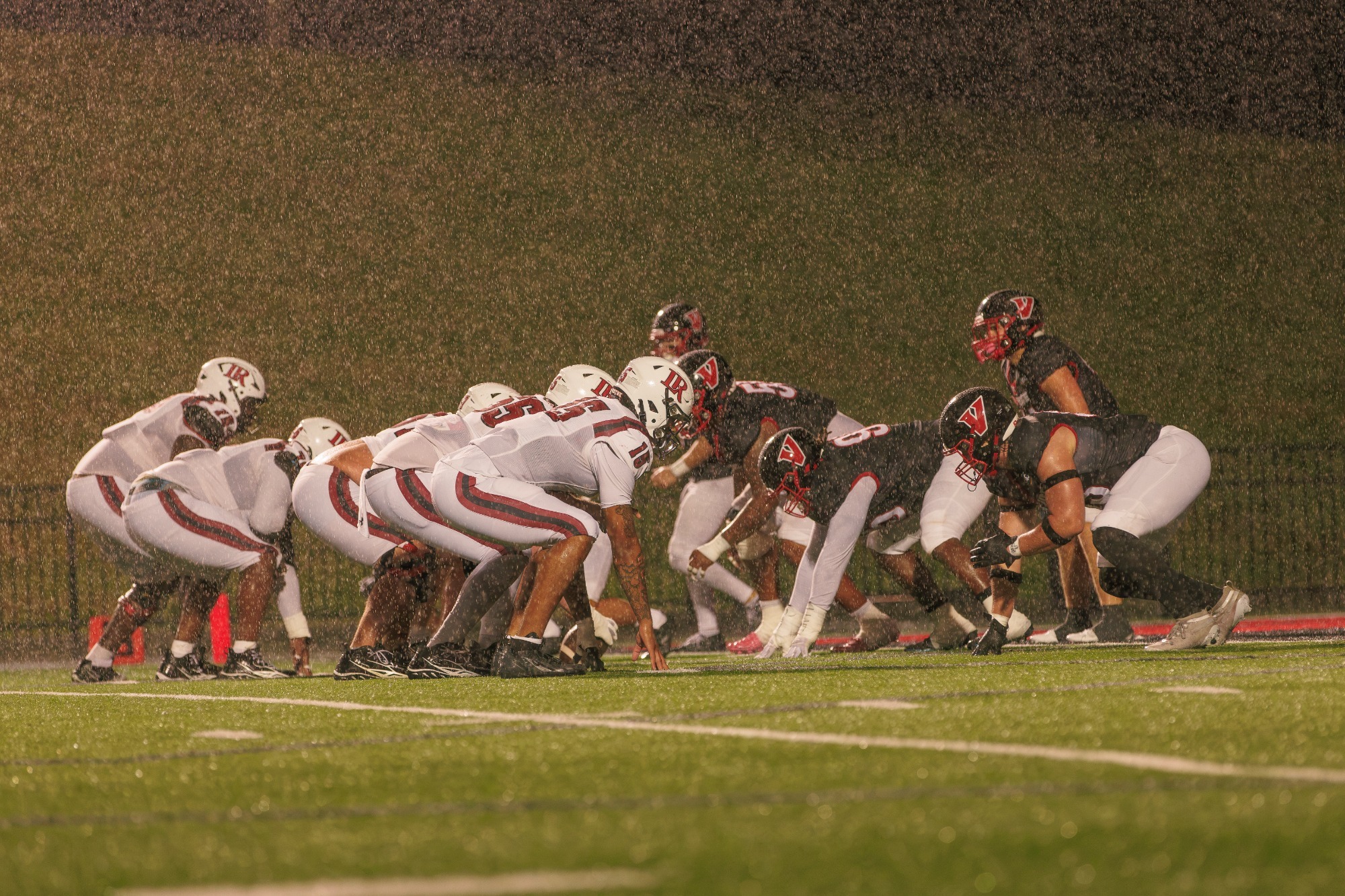 Football drives the ball against Lenoir-Rhyne in the driving rain -- 10-10-2026
