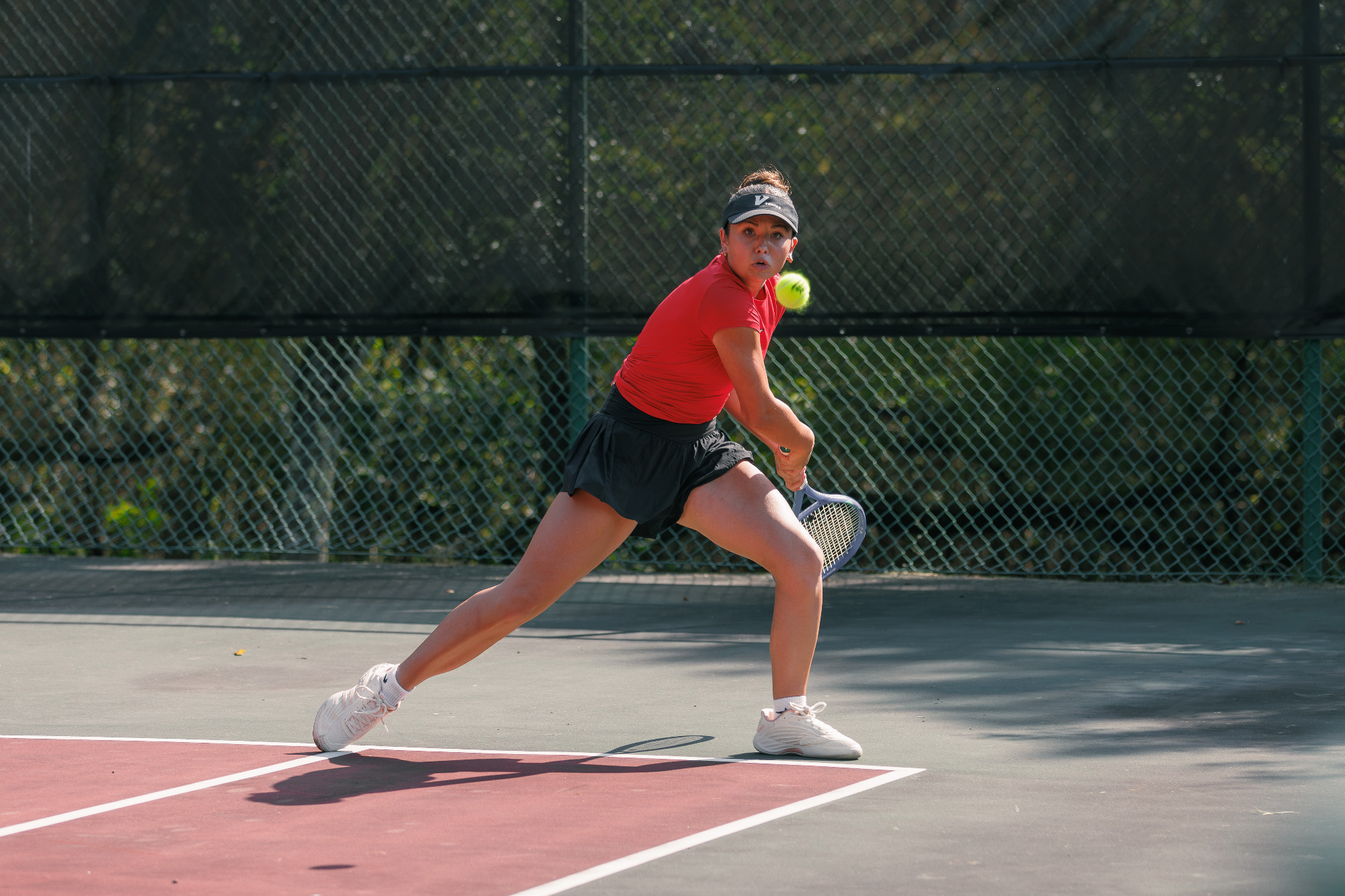 Player hitting the ball vs C-N -- 10-2-2026