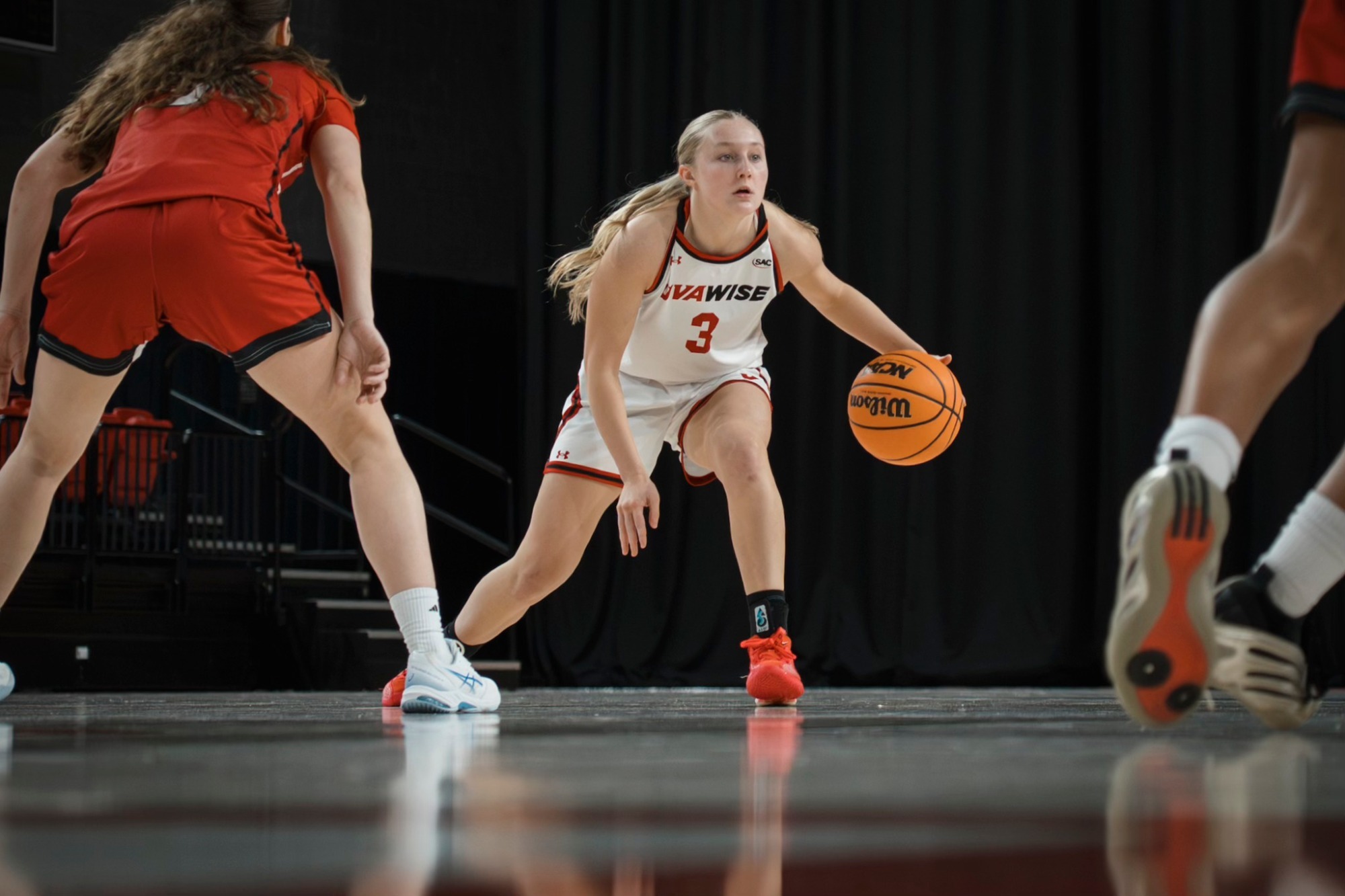 Kyndra West dribbles the ball against Newberry