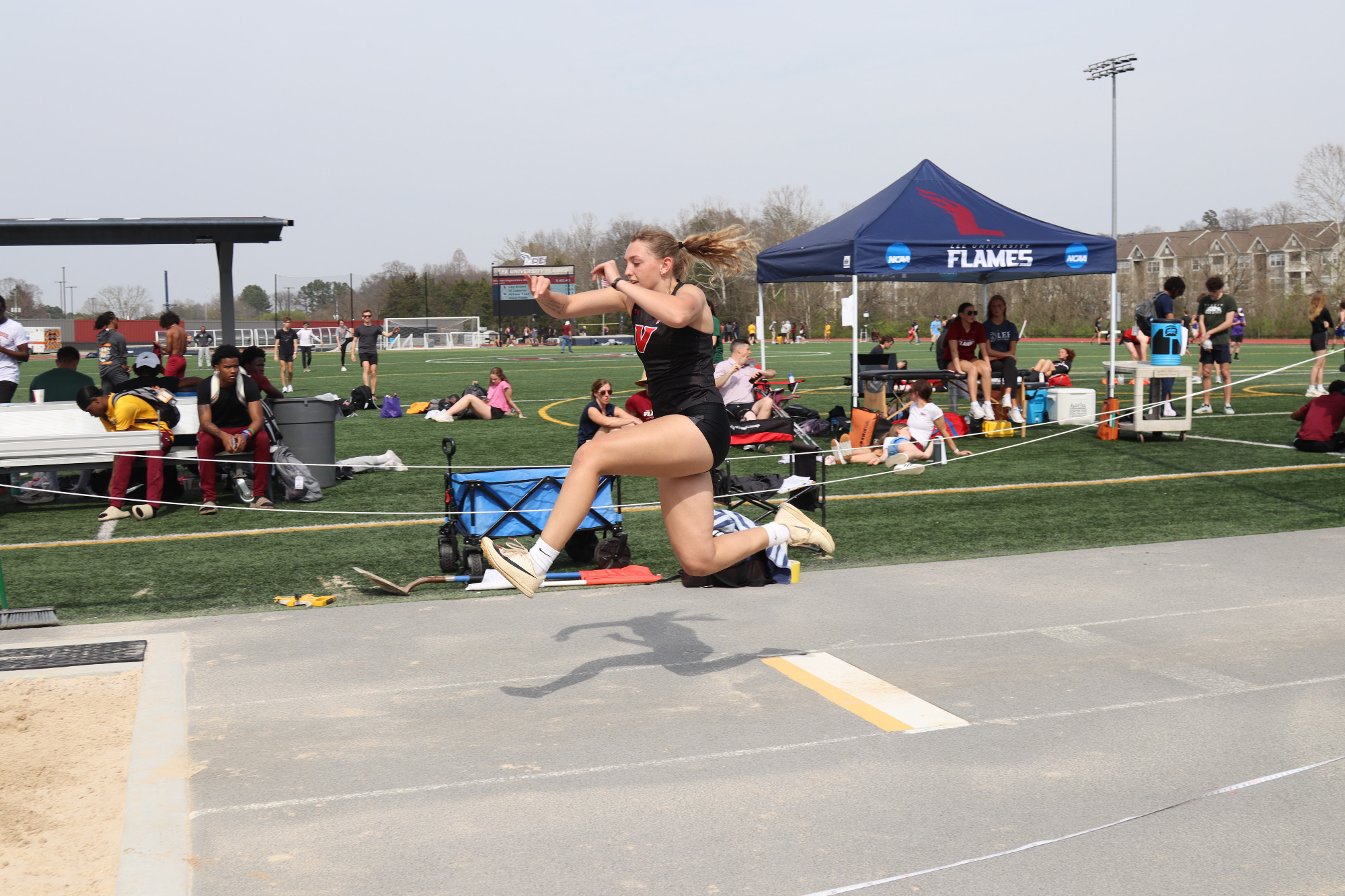 Female long jumper jumps at the Lee Invitational