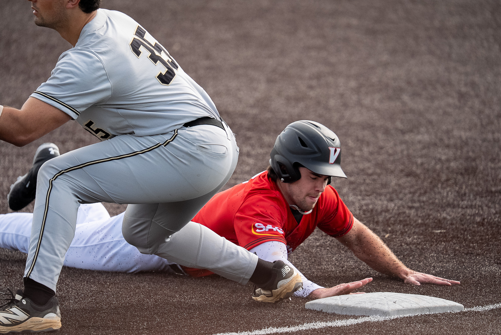 Baseball player slides into base and beats the tag vs Ferrum -- 2026