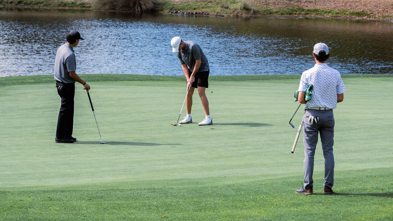 Golfers play on the green at Pawleys Island
