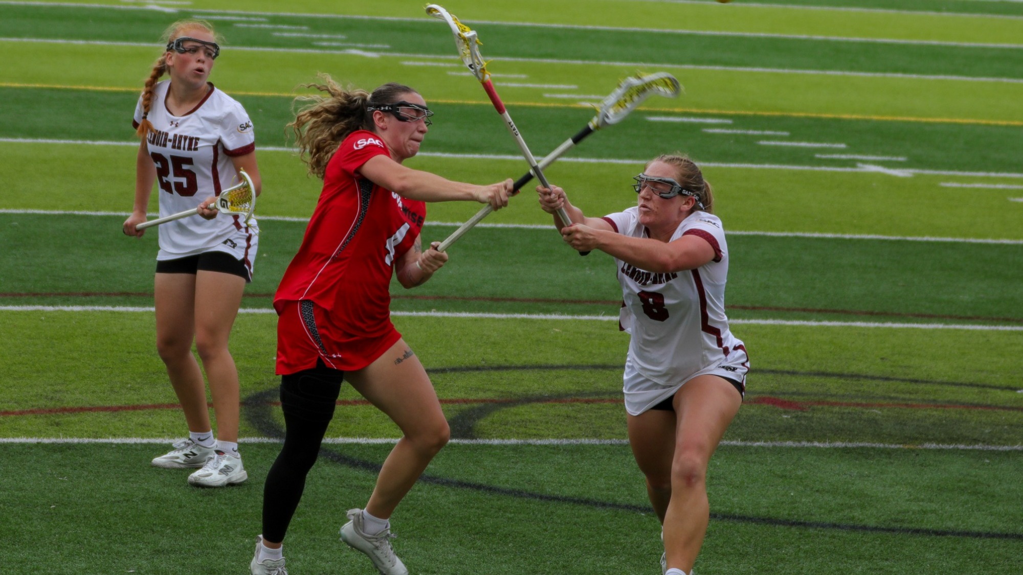 Caitlyn Schultz battles Lenoir-Rhynes's Keegan Hudspeth for the ball -- 2026