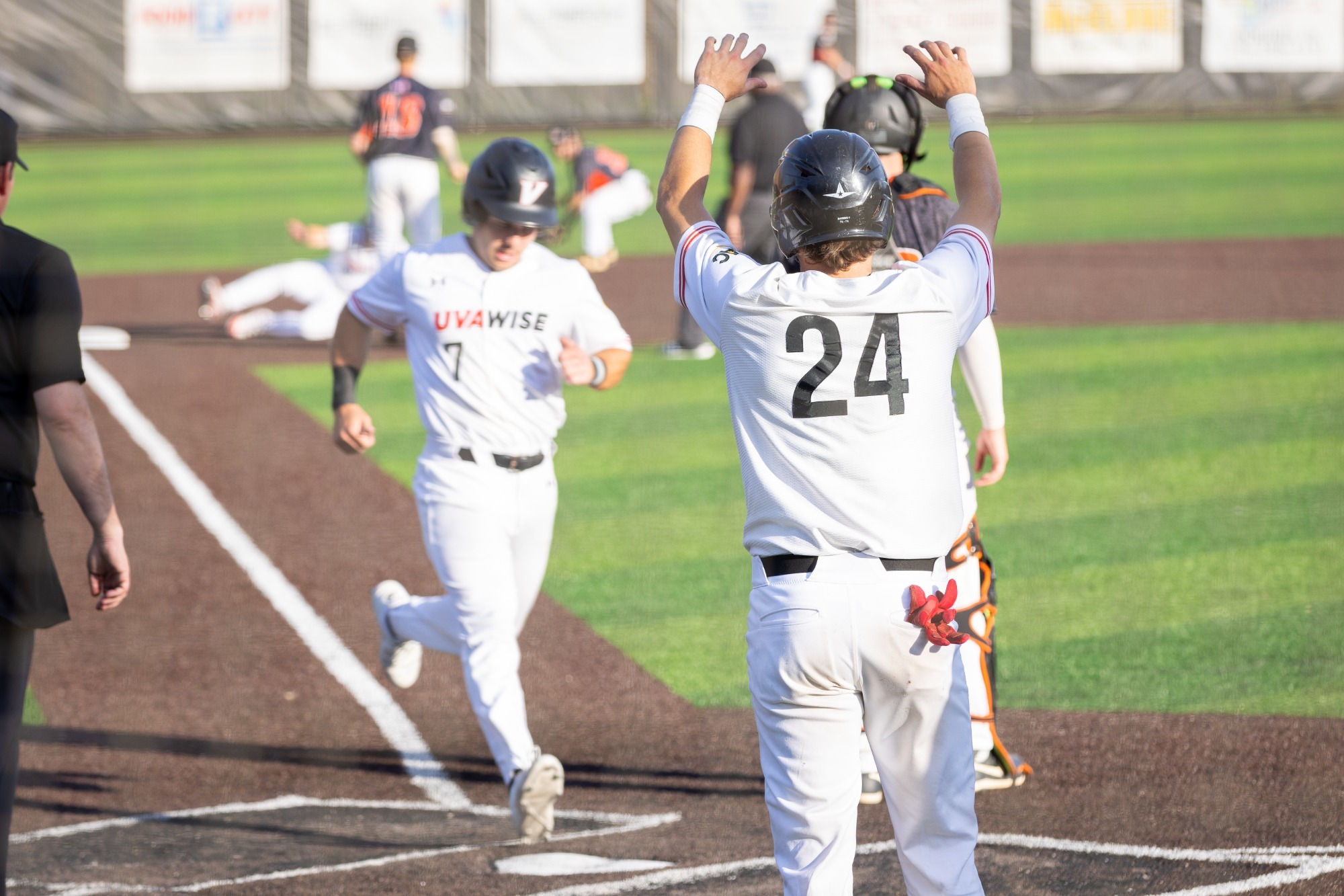 Jaden Ruehling scores as Jacob Boyle celebrates in the foreground vs Tusculum - 2026