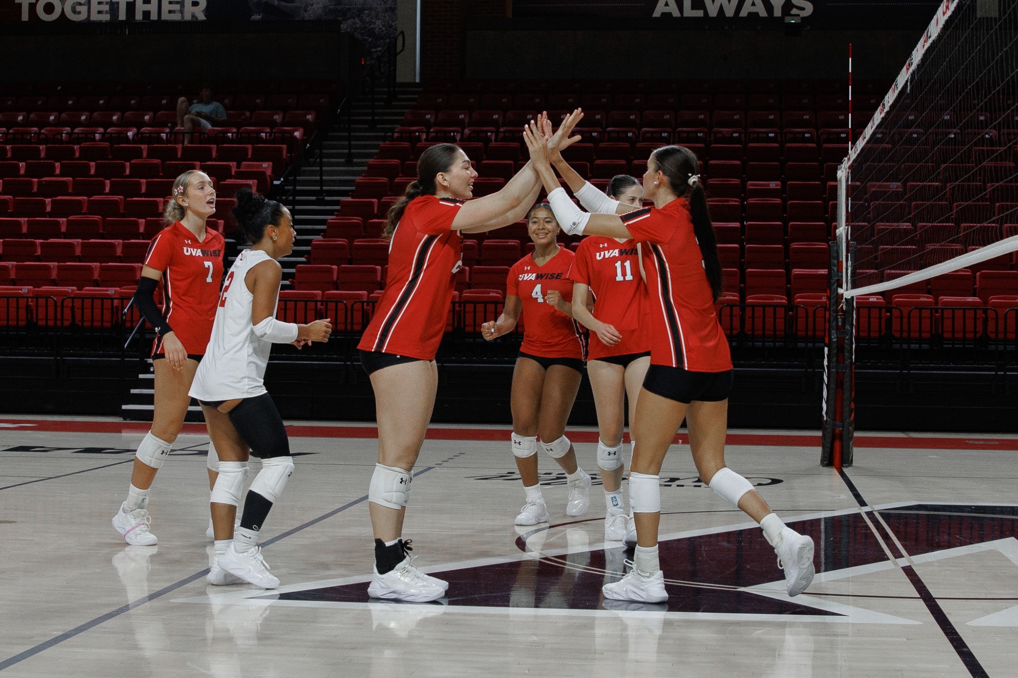 Celebration photo during preseason volleyball scrimmage -- 2026
