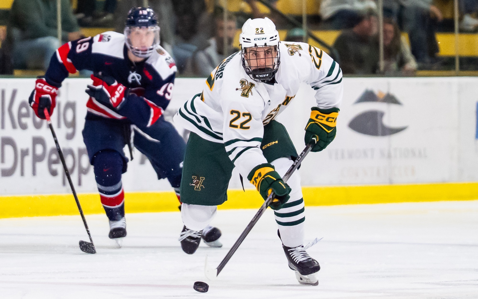 First year forward Ethan Burroughs skates in the neutral zone with a Brock defender backchecking behind him