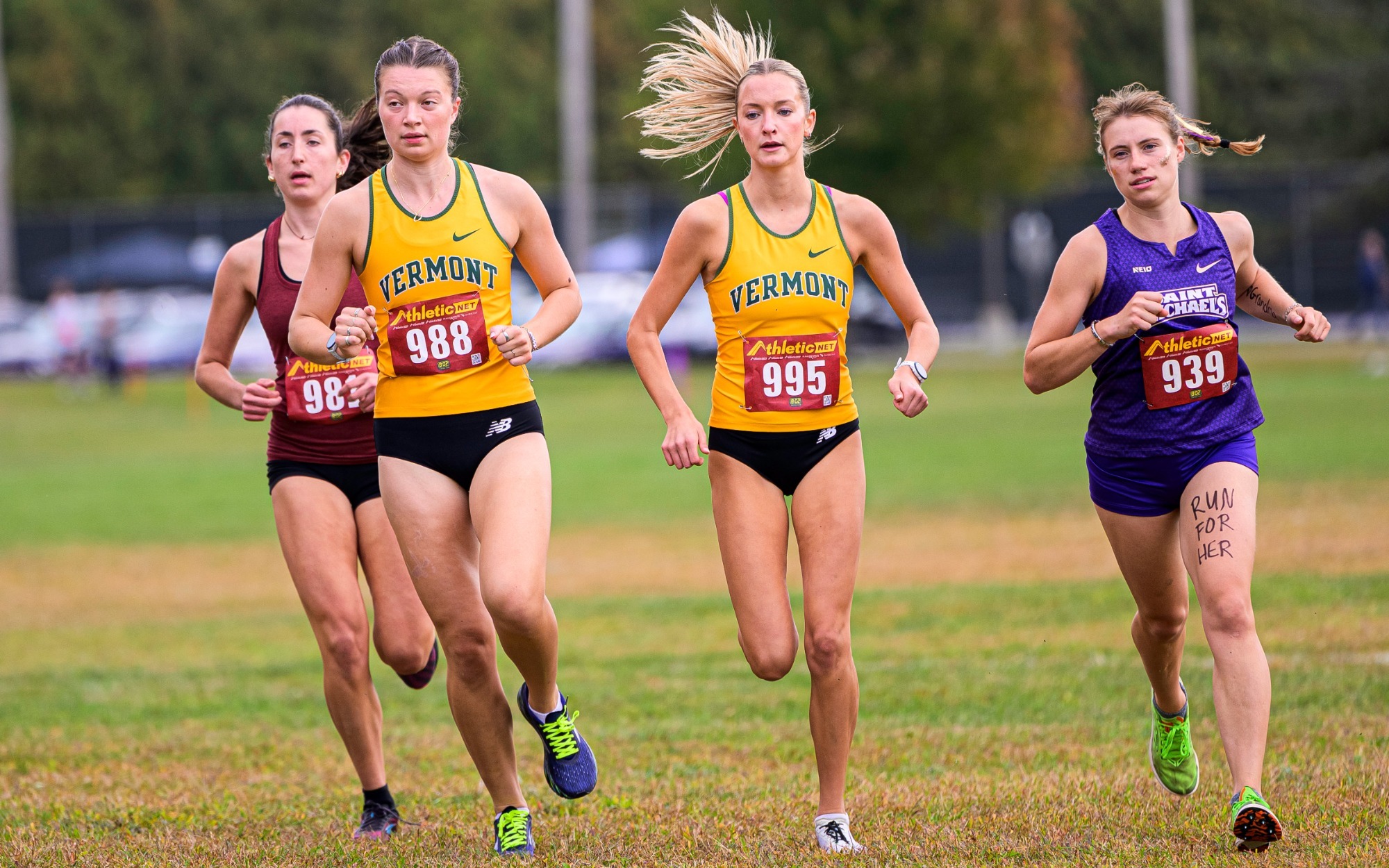 Pair of Catamounts runners round the corner at St. Michaels College