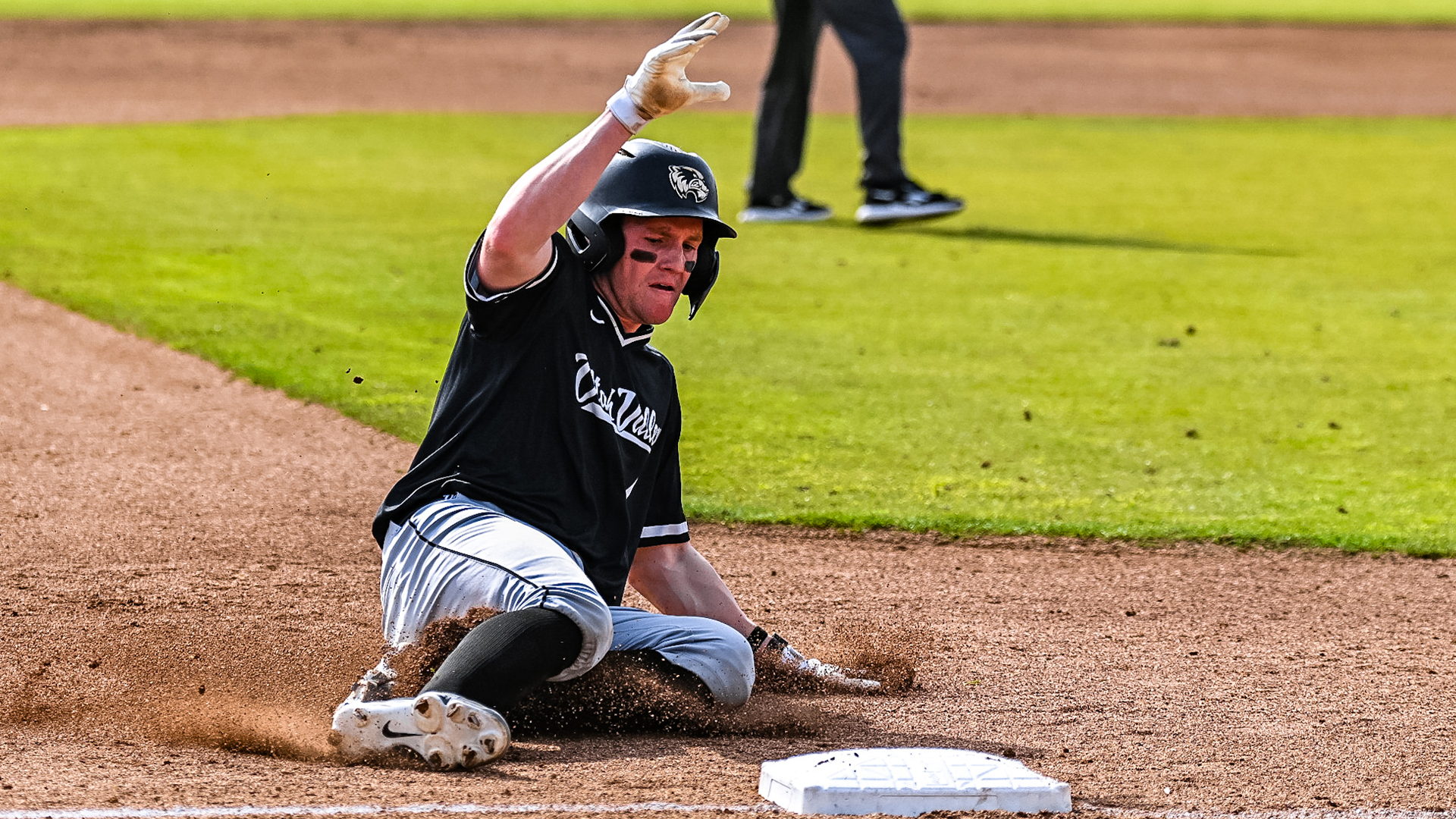 Mason Strong slides into third base