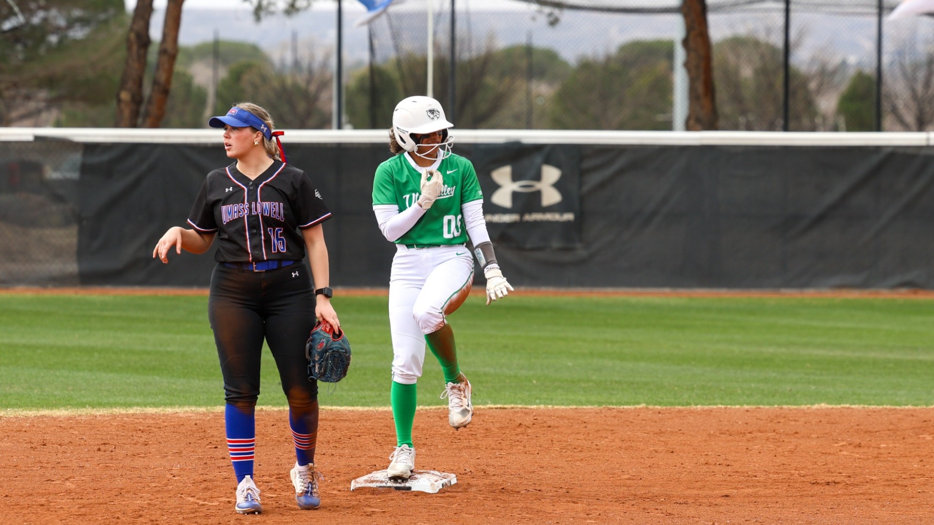 Angelique Mann does the Heisman pose after hitting a double vs UMass Lowell