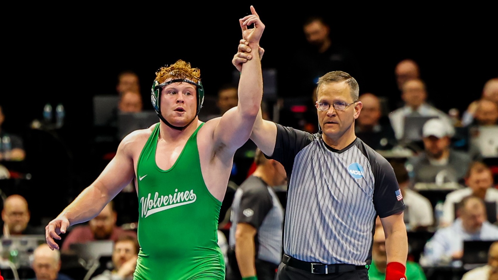Jack Forbes gets his hand raised after winning at the NCAA Championships in Cleveland