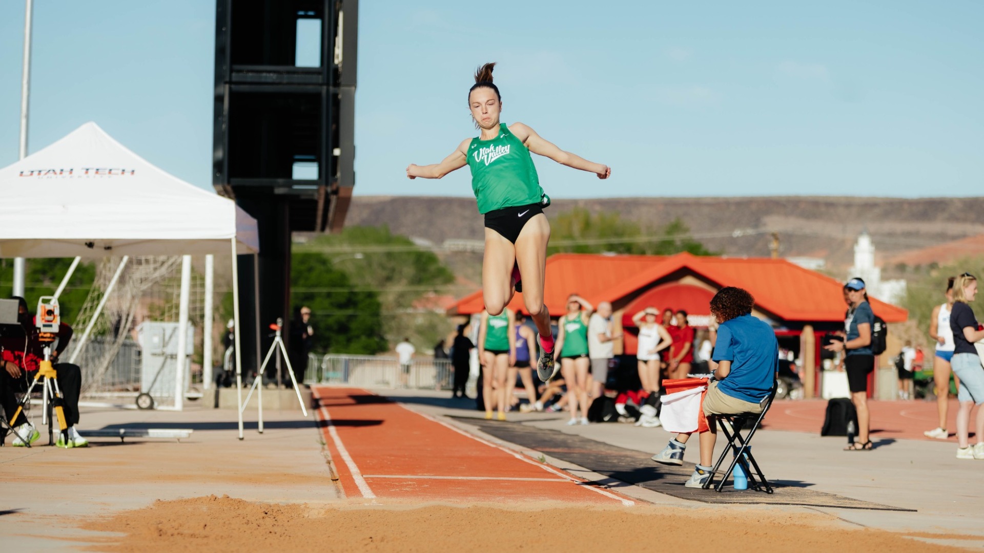 Maddie Passmore does the long jump at the Utah Tech Invitational.