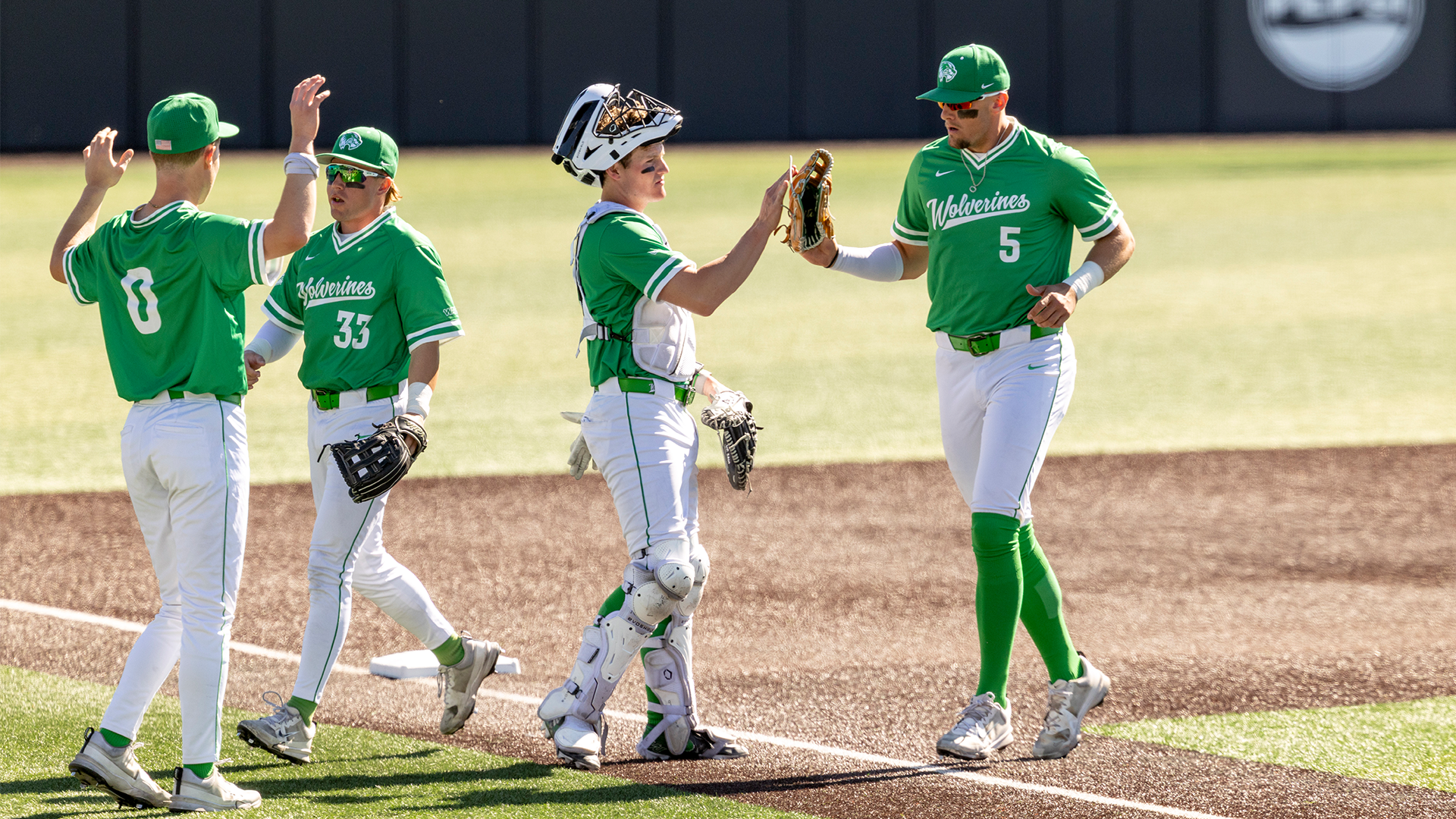 Carpenter high five with Mason Strong