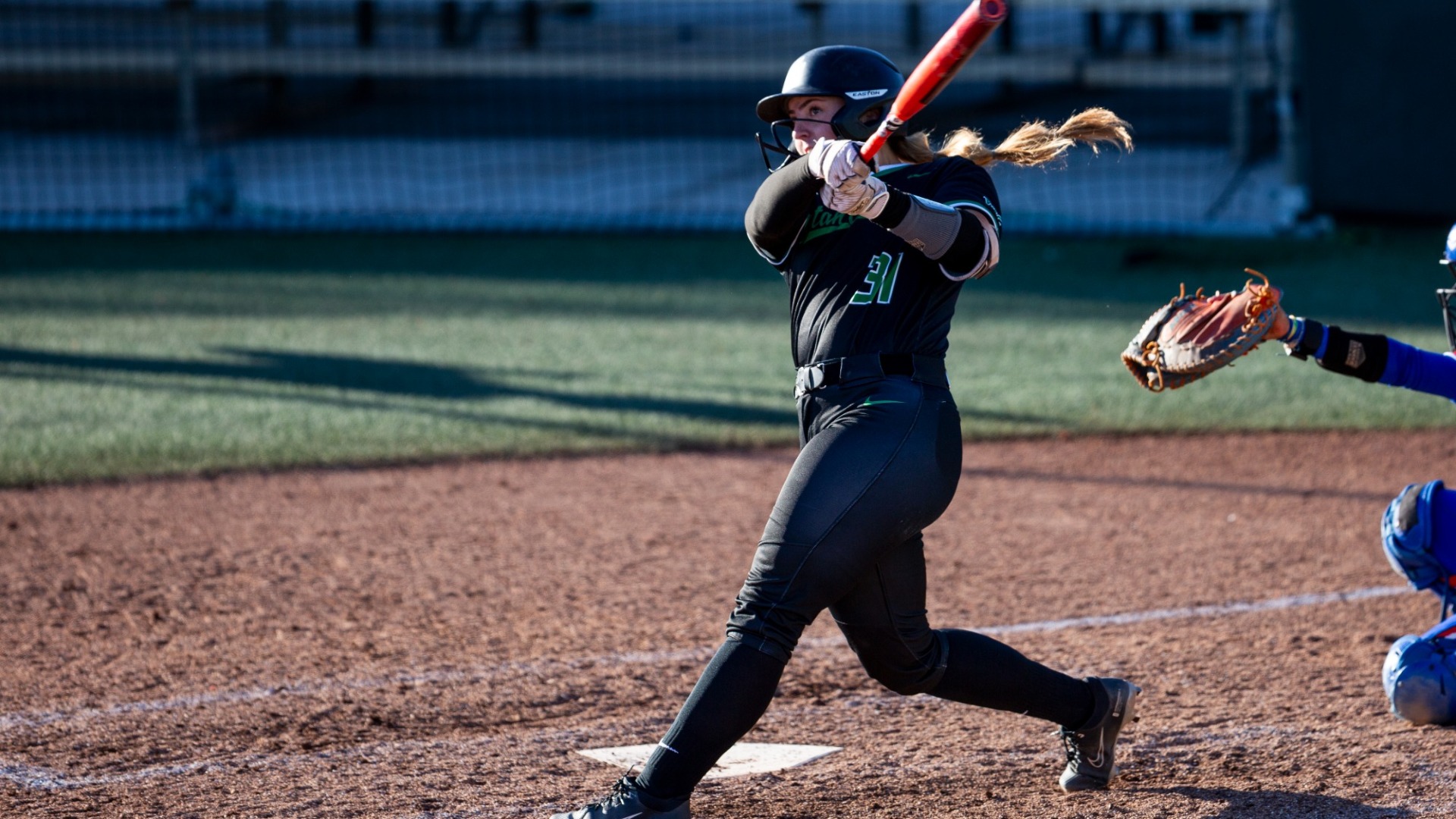 Maddie McSorley hits a ball vs UTA.
