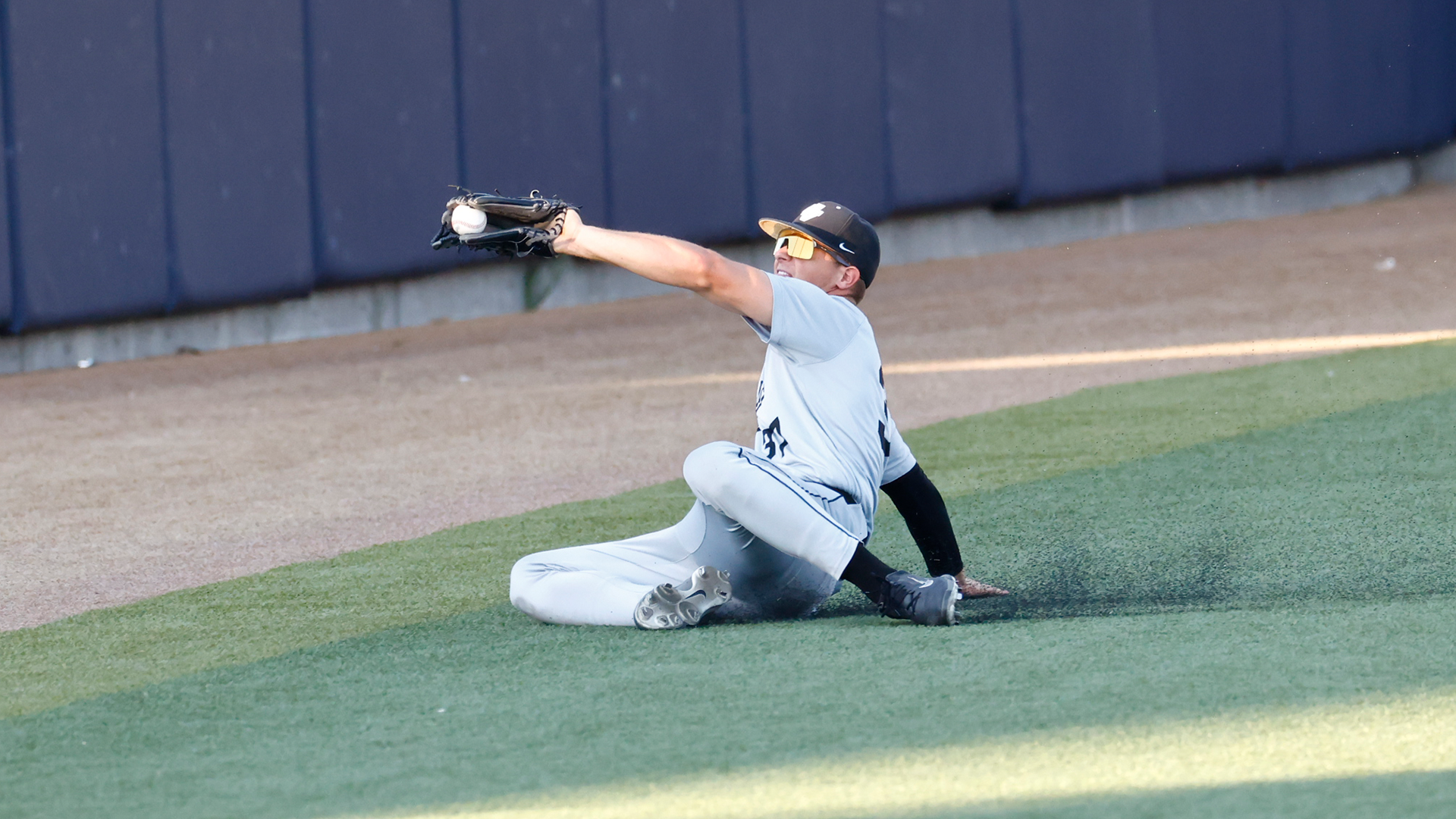 Derek Houston makes a sliding catch at BYU