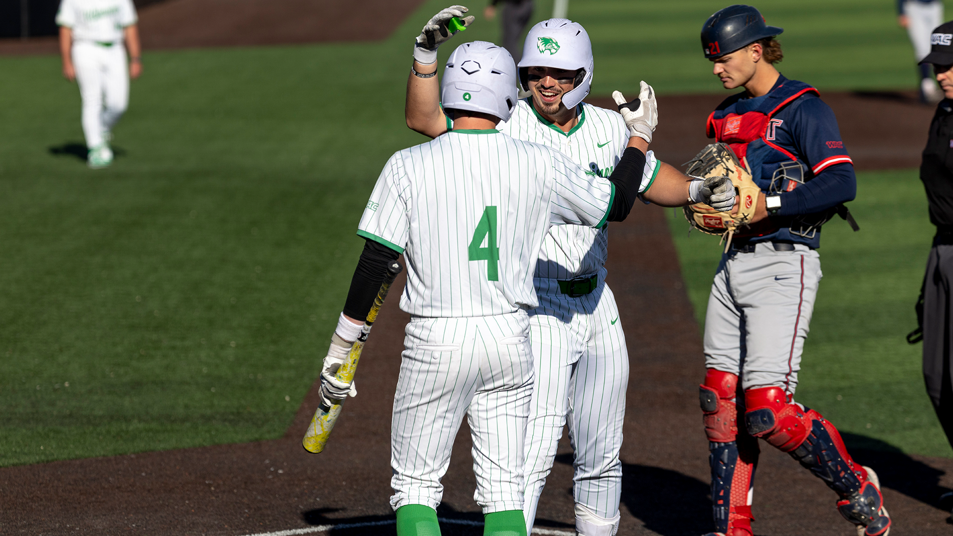 Hunter Katschke and Mason Strong at the plate after a homer