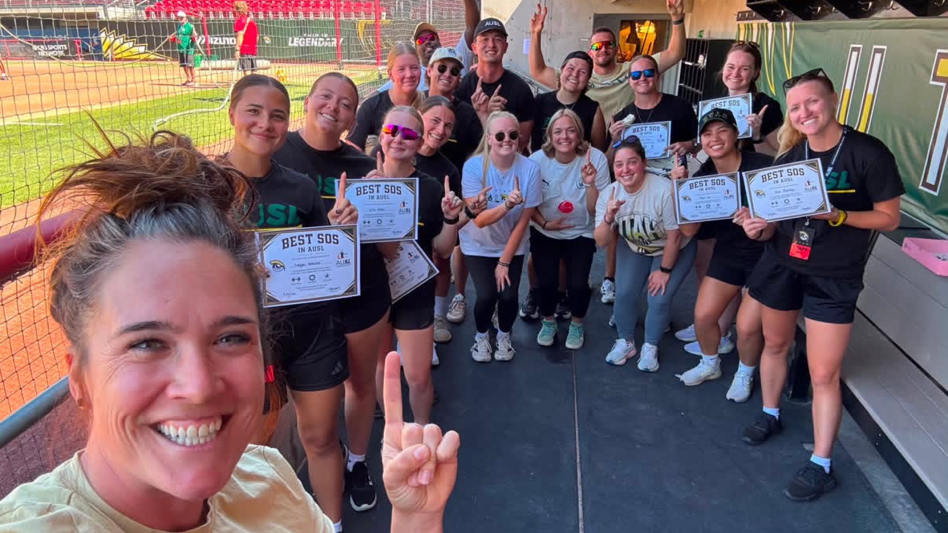 Megan Sterzer and Ella Miller (first two on the left) with the Utah Talons softball ops crew before the last Talons home game. 