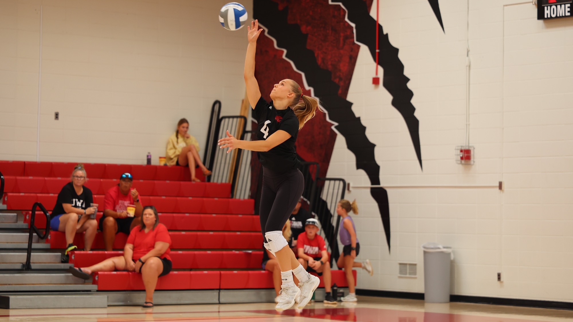 West Alabama volleyball player Ola Winiarek (#4) jumps to serve the ball during a match at Pruitt Hall.