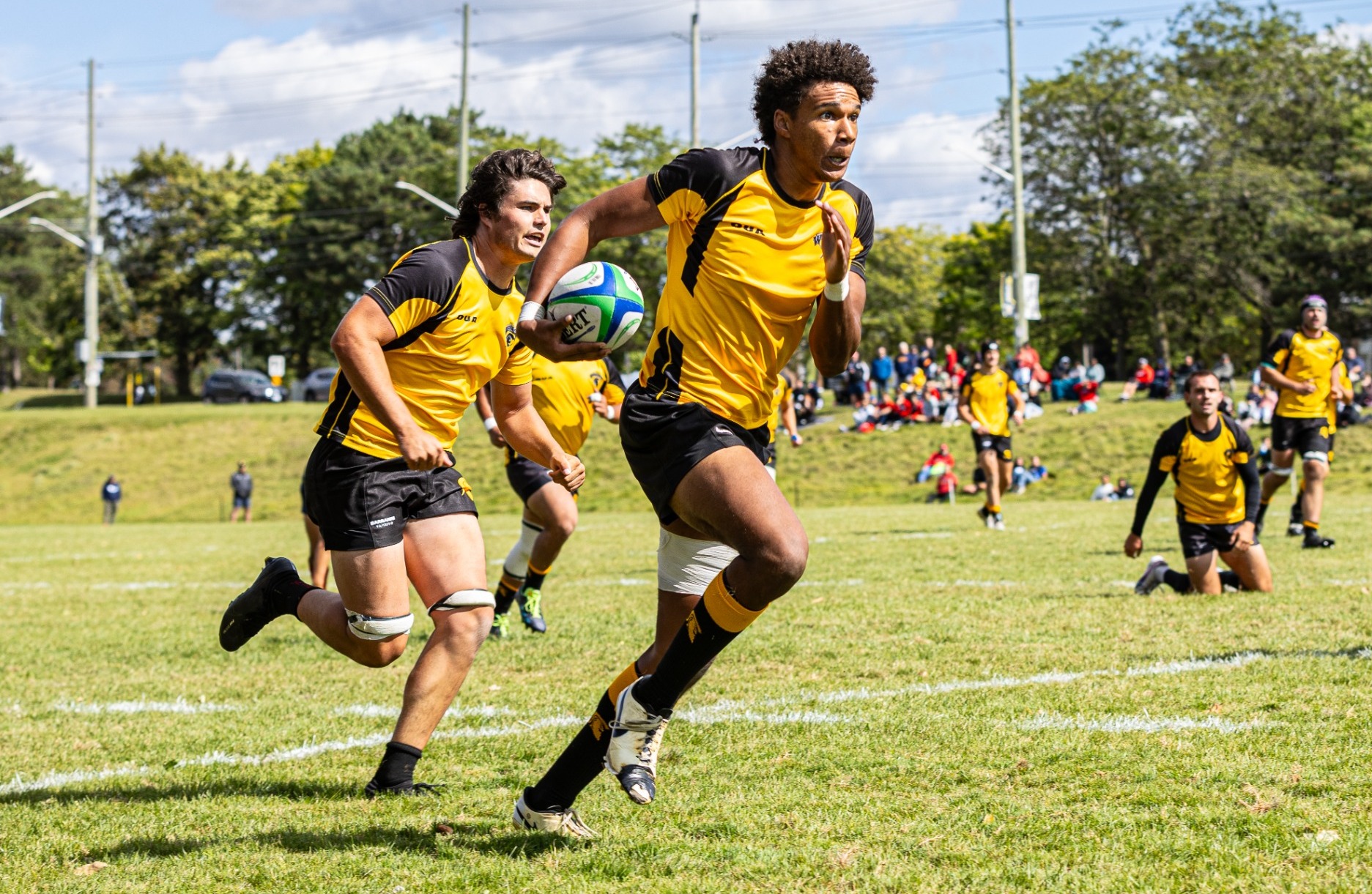 Warriors run up the field.