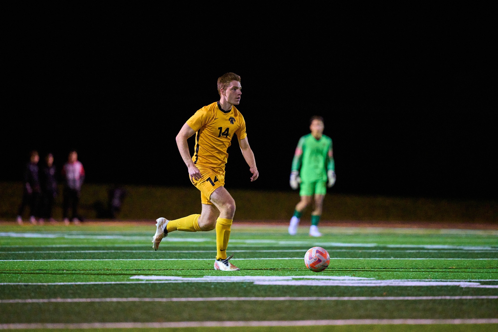 Warrior carries ball up the field.