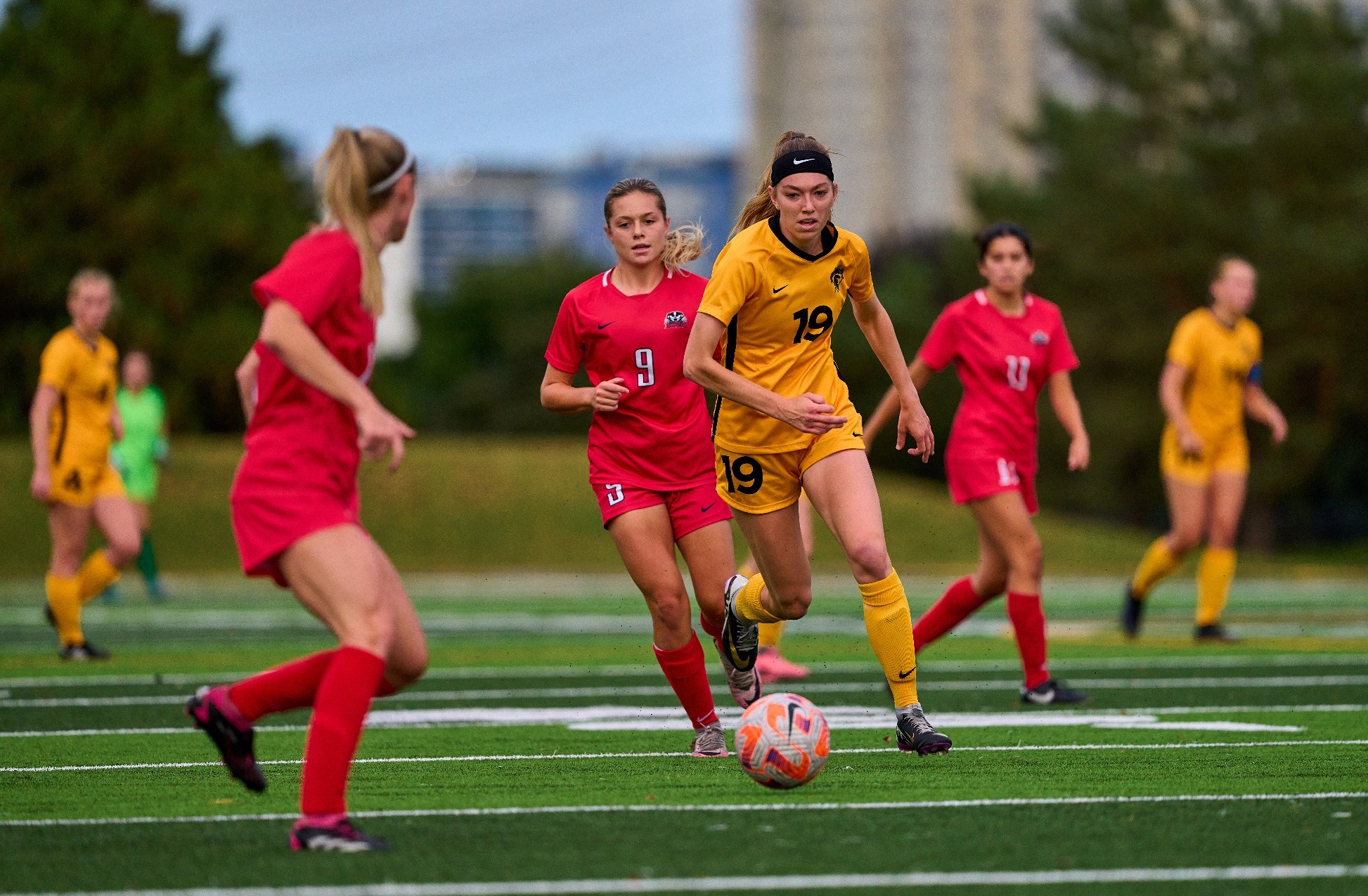 Warrior carries the ball up the field.
