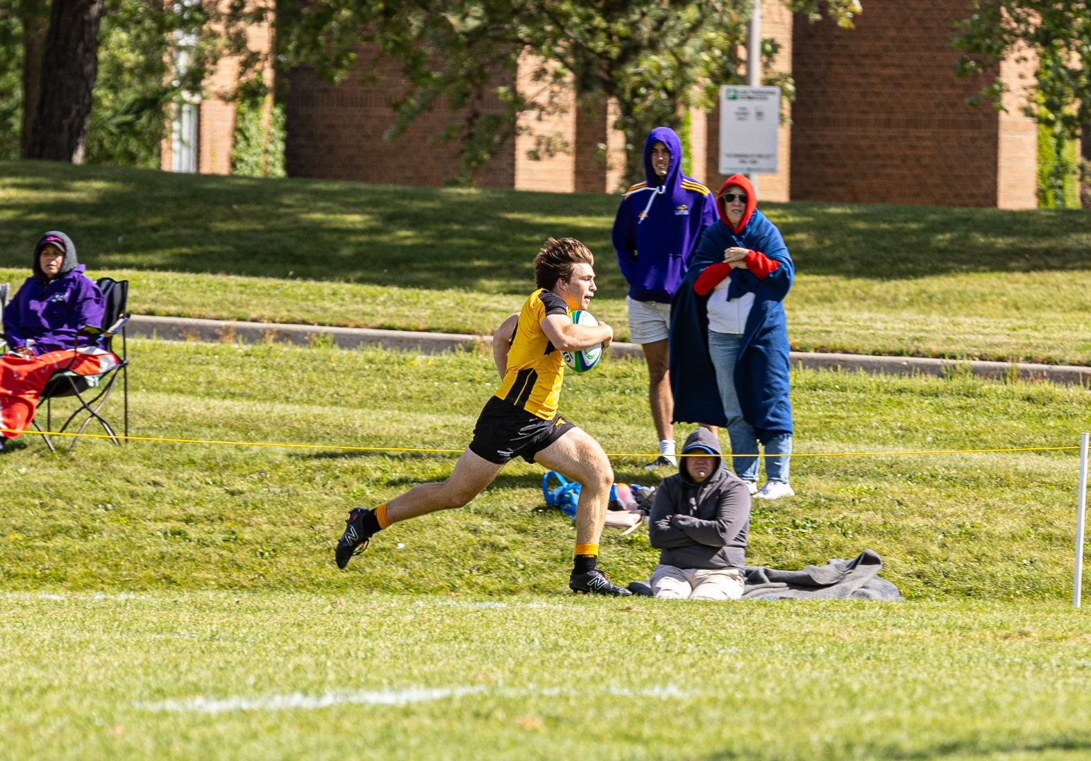 Warrior running up the field.