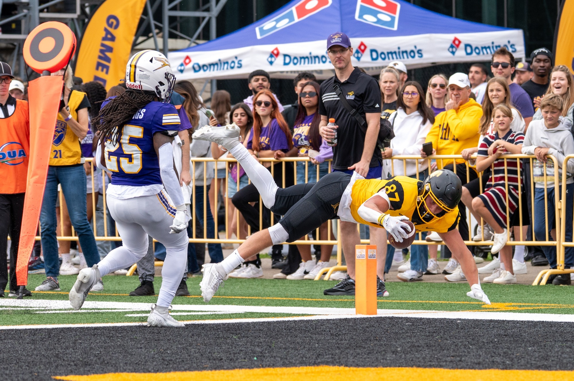 Evan Basalyga dives for a touchdown against Laurier