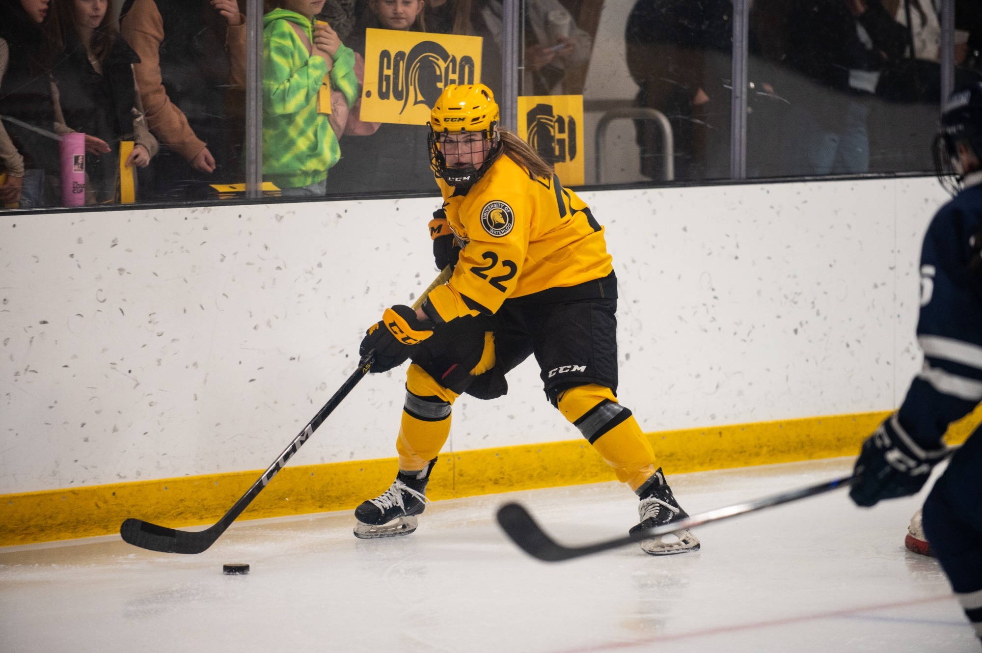 Sarah Bestic carries the puck