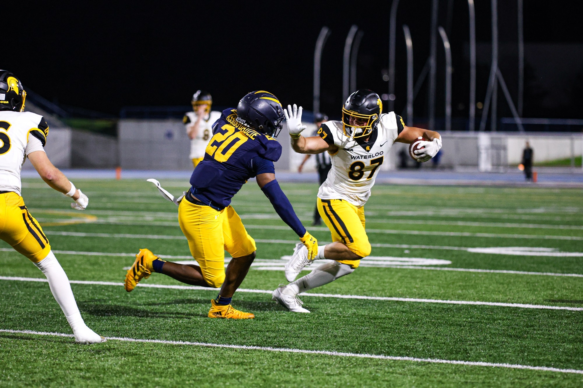 Evan Basalyga stiff arms a defender in Windsor