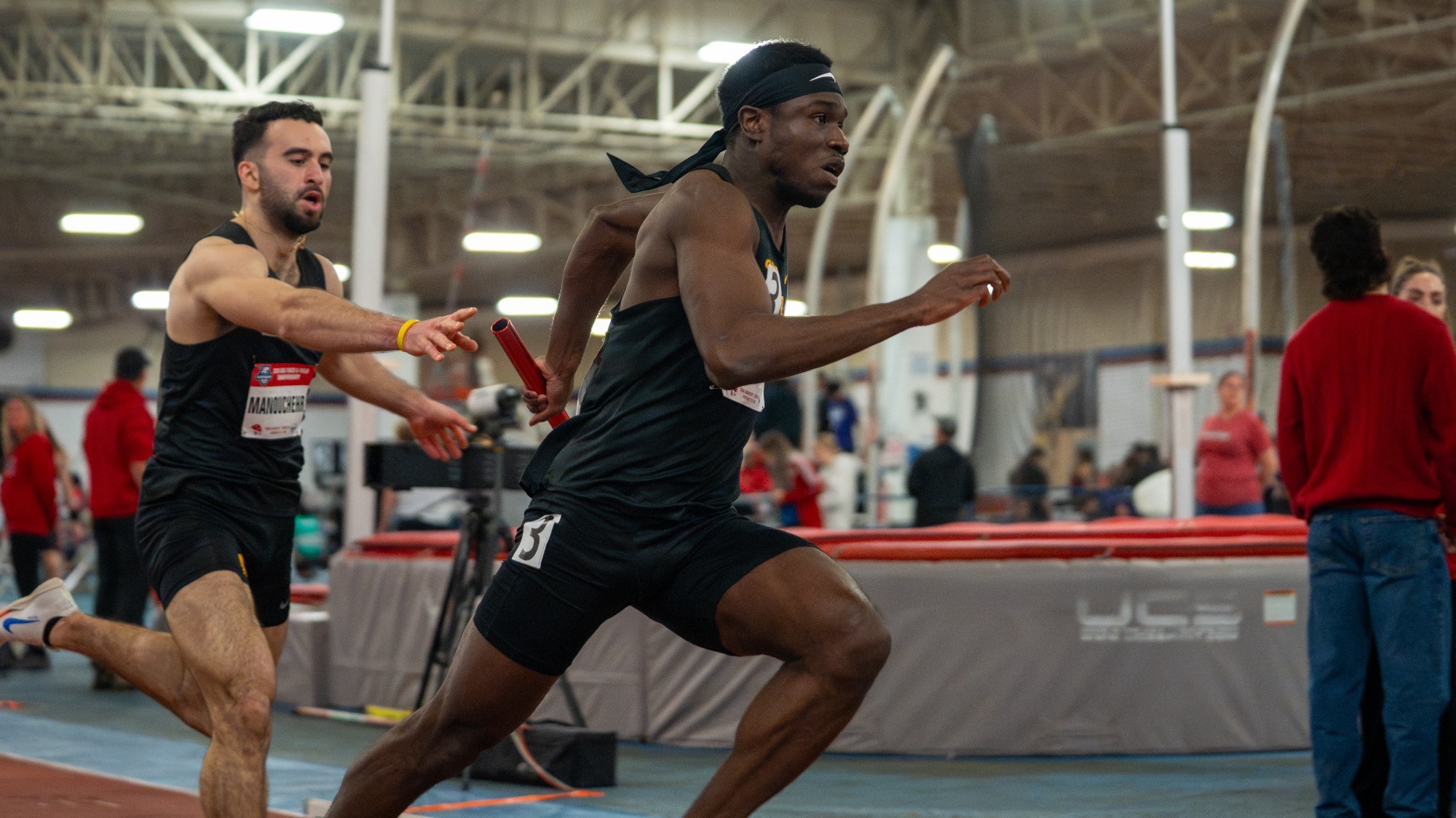 David Gbenjo takes the baton in a relay