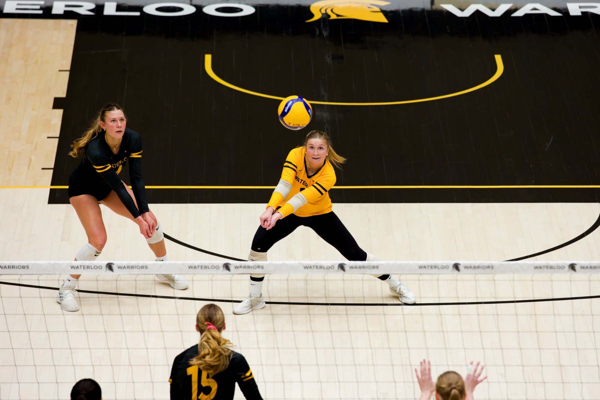 Ashlynn Freiburger & Sydney Batiuk prepare to receive a serve.