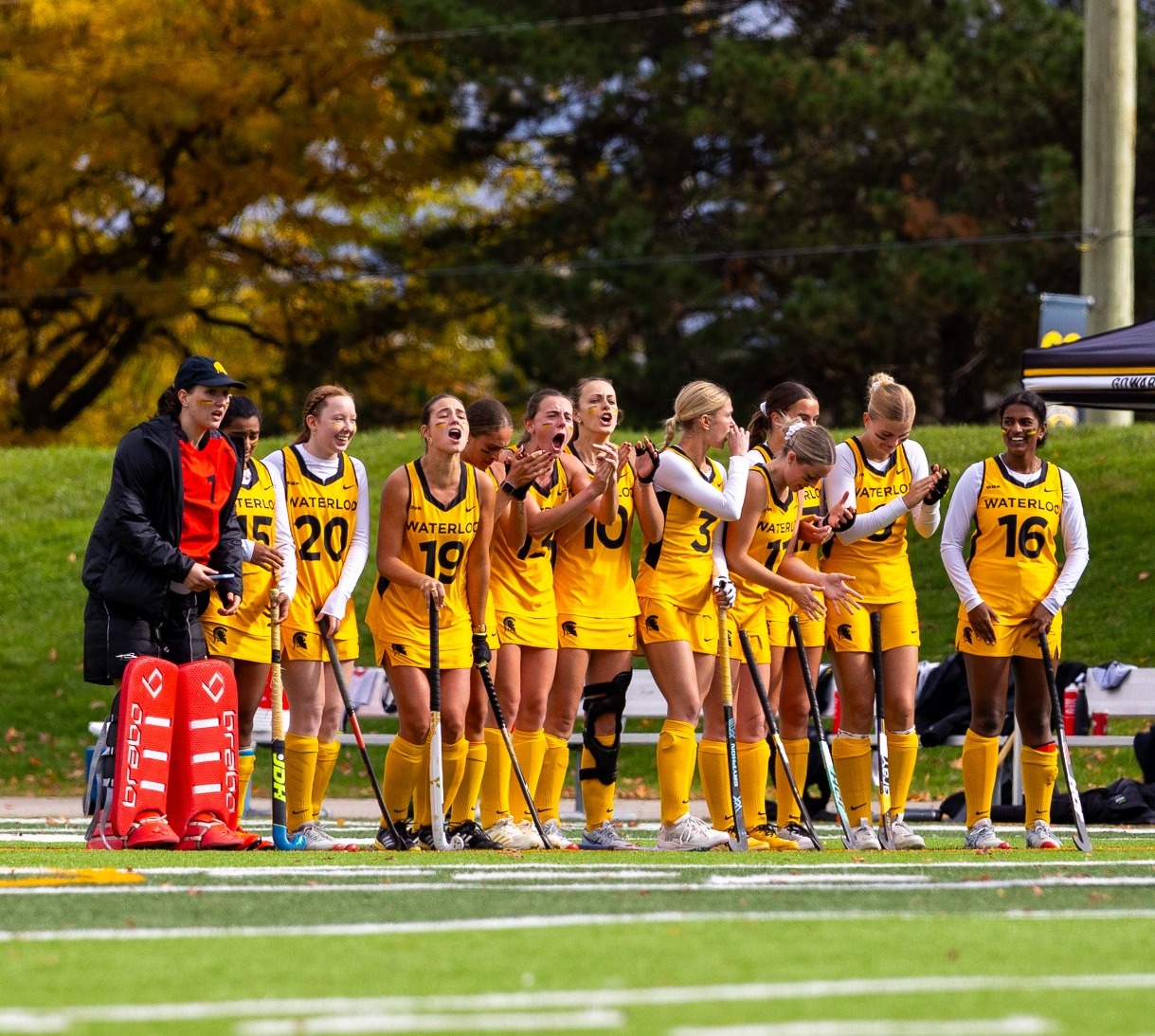 Field Hockey Team Watches From The Sidelines