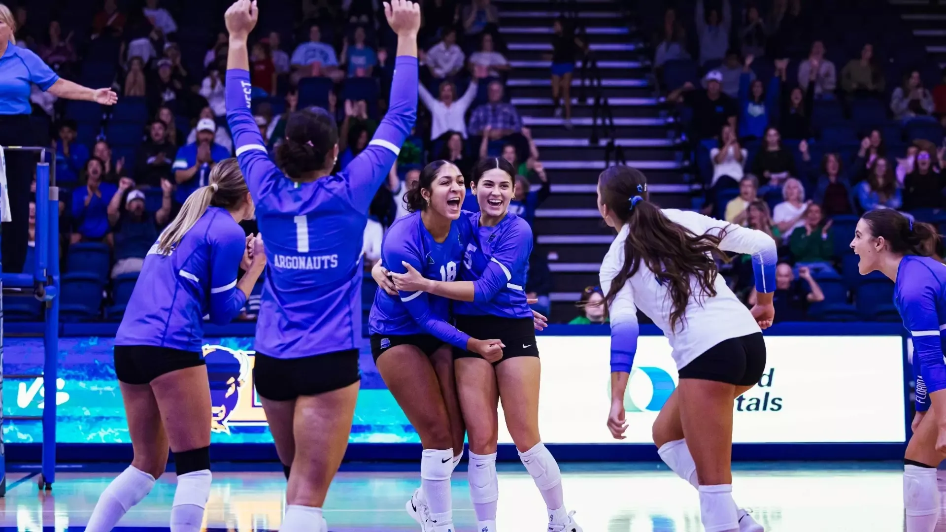 Ku and Karyna celebrate with team
