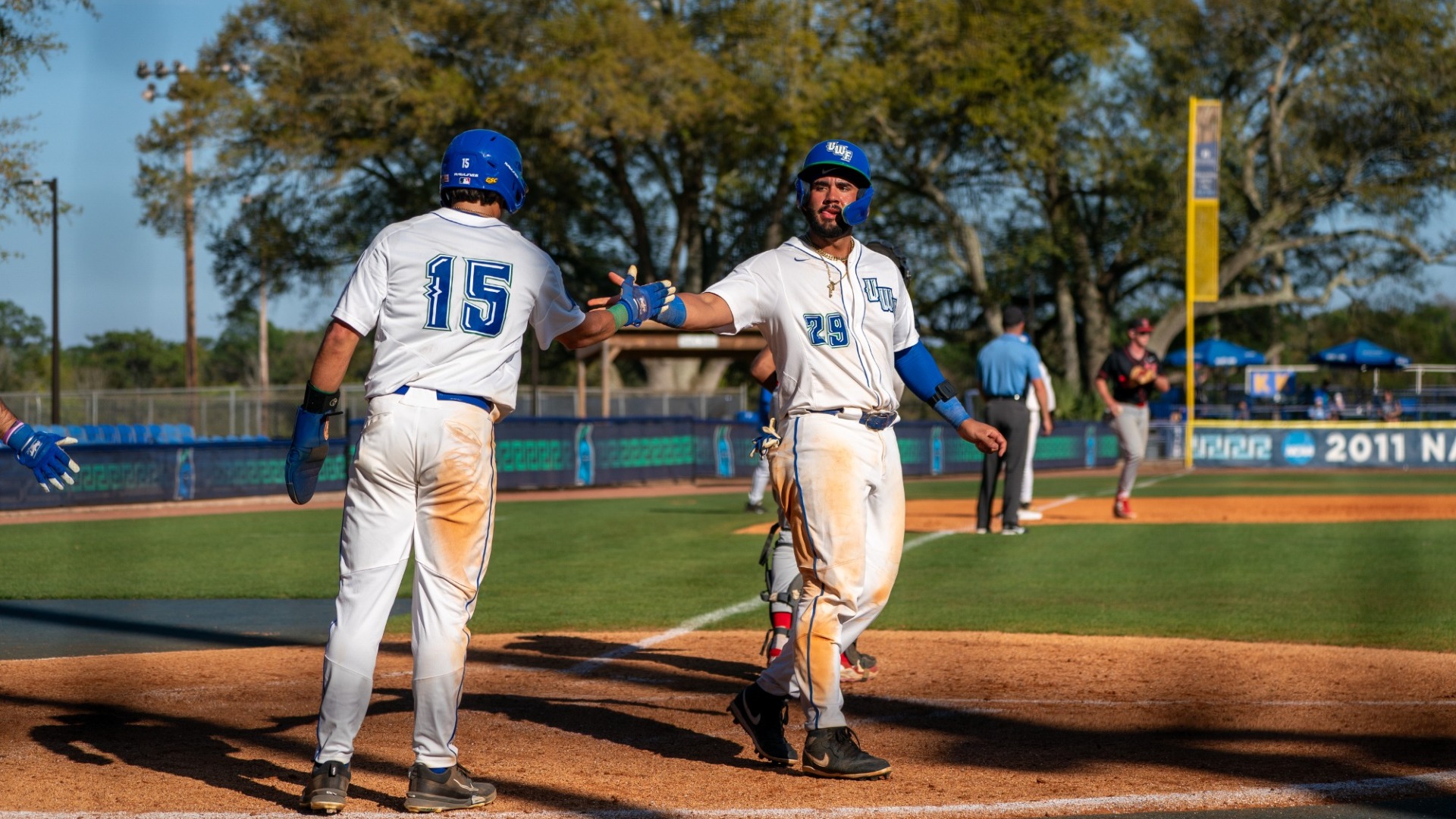 DeJesus and Mendez celebrate at home plate