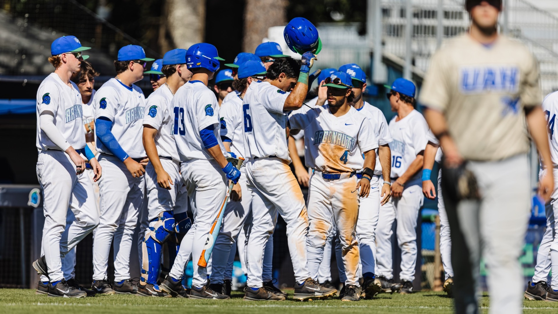Baseball team together outside of dugout