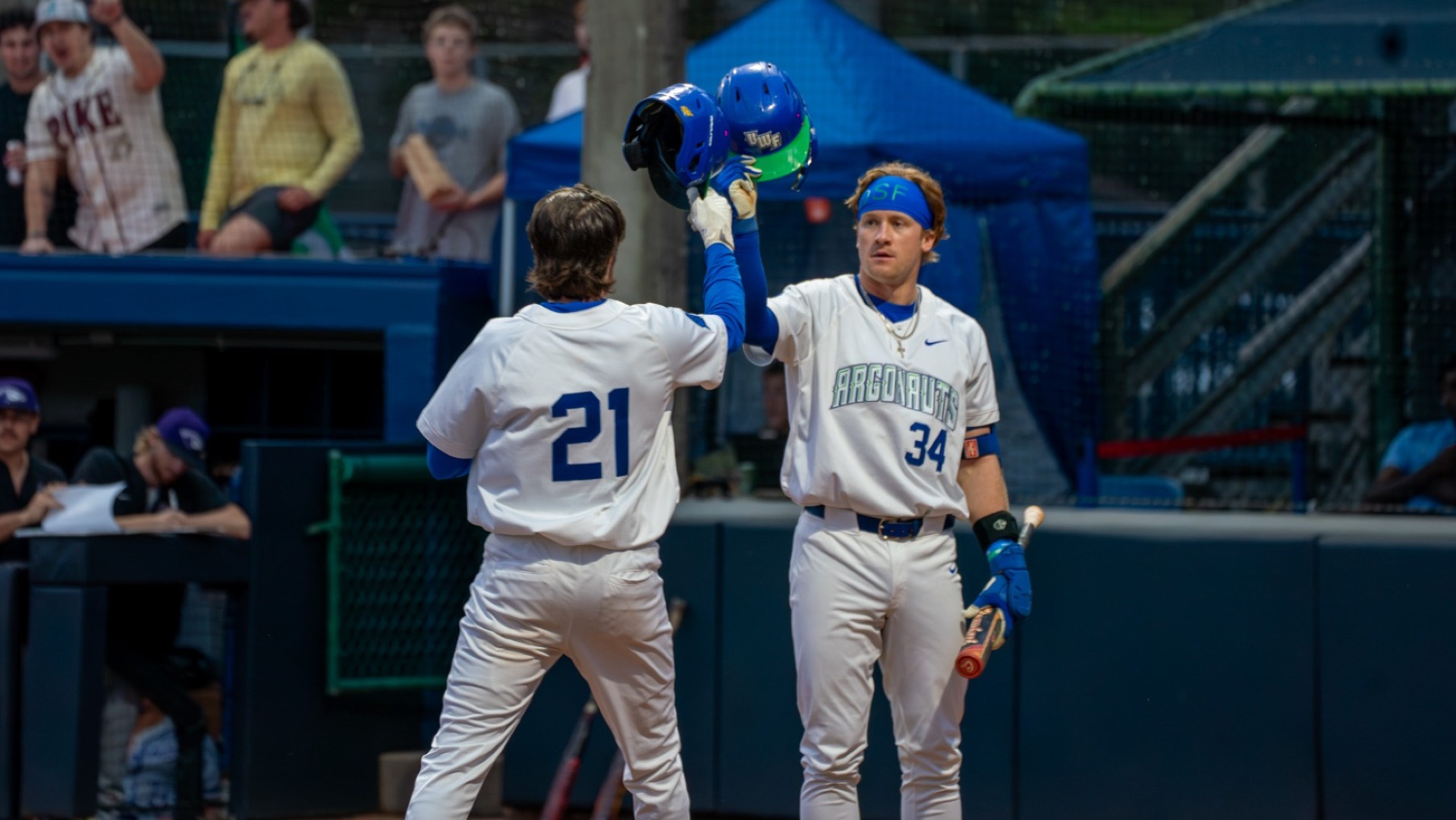 Stokes and Lybrook celebrate after a homer