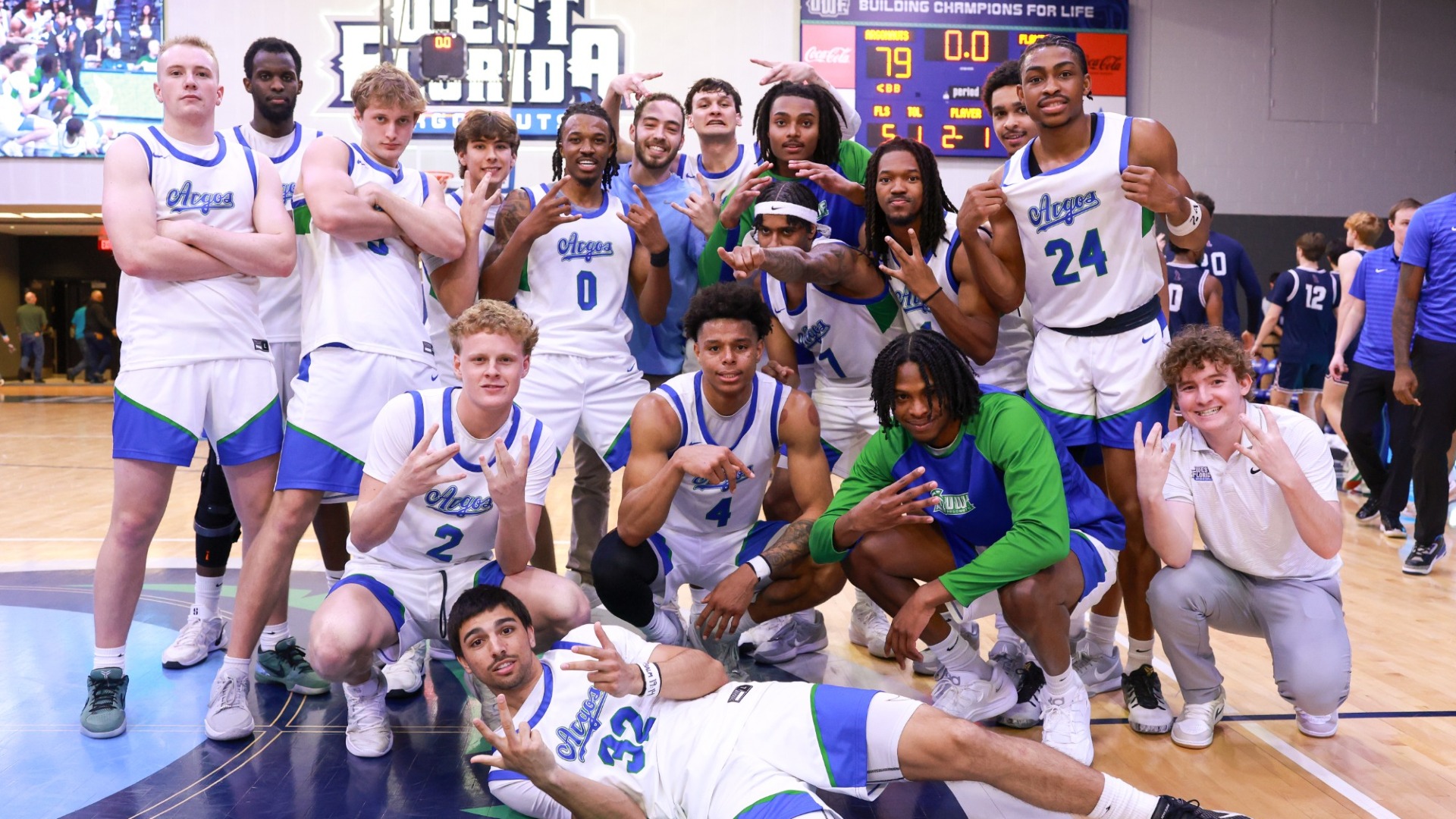 Basketball celebrating after advancing to GSC Championship
