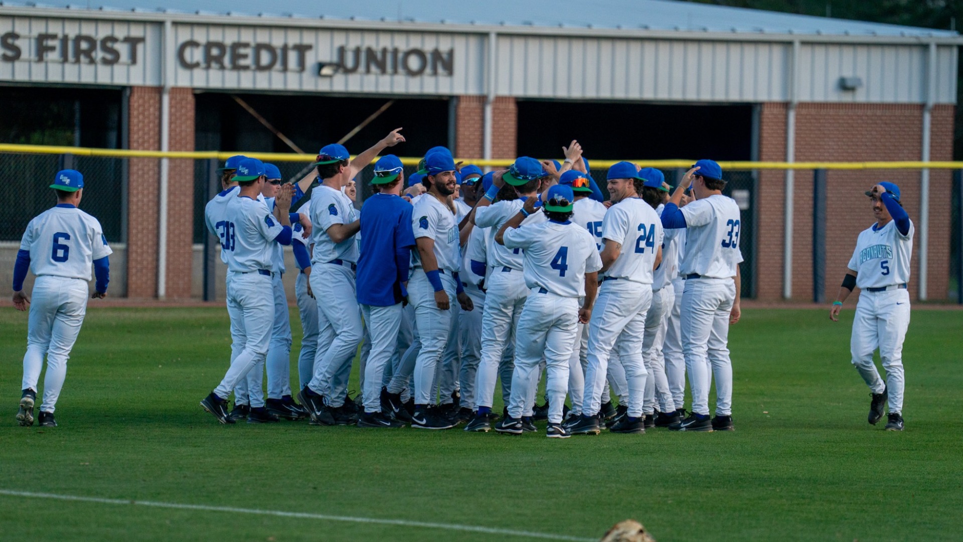 Team pregame huddle in outfield