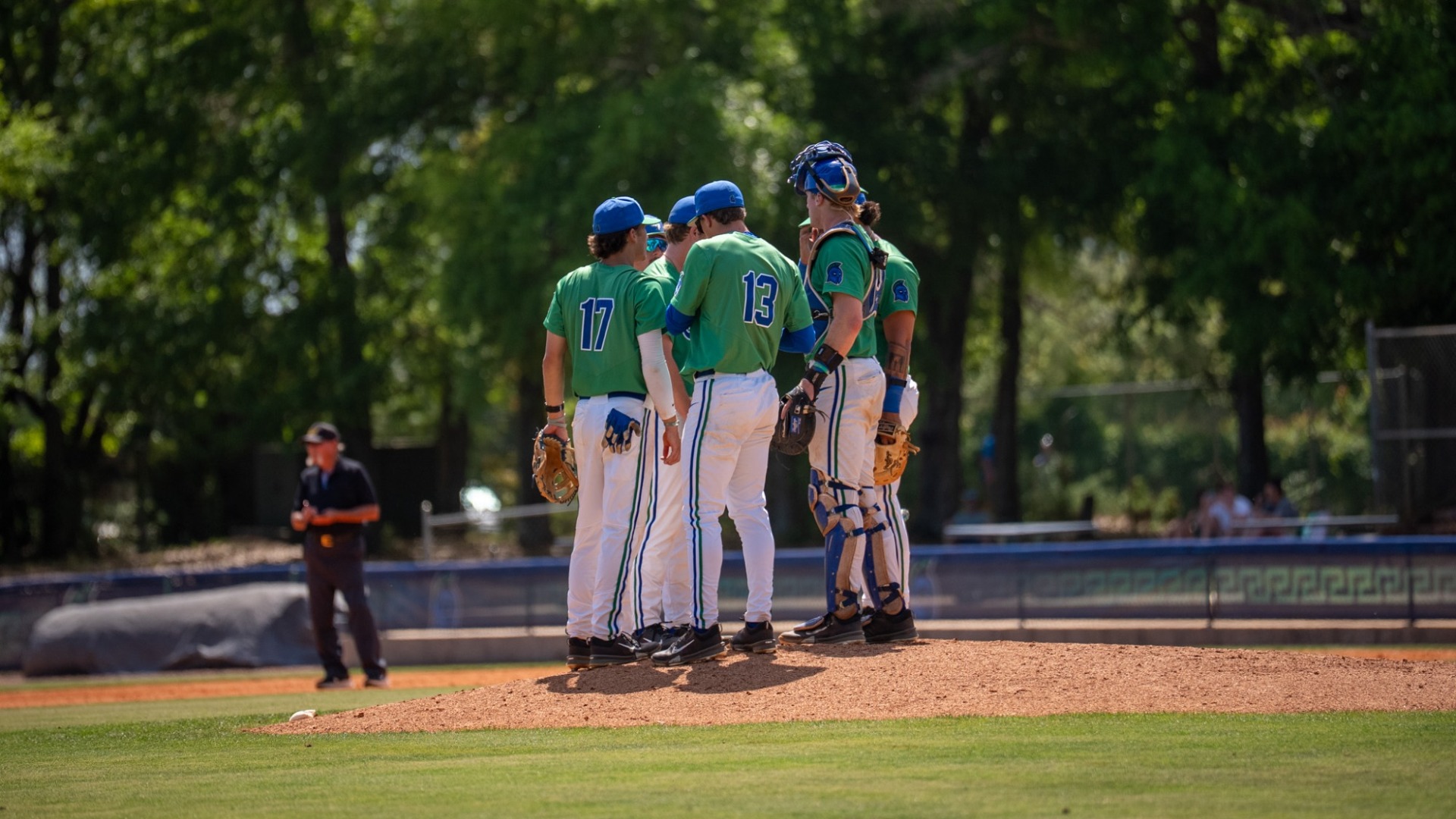 Players meet on the mound