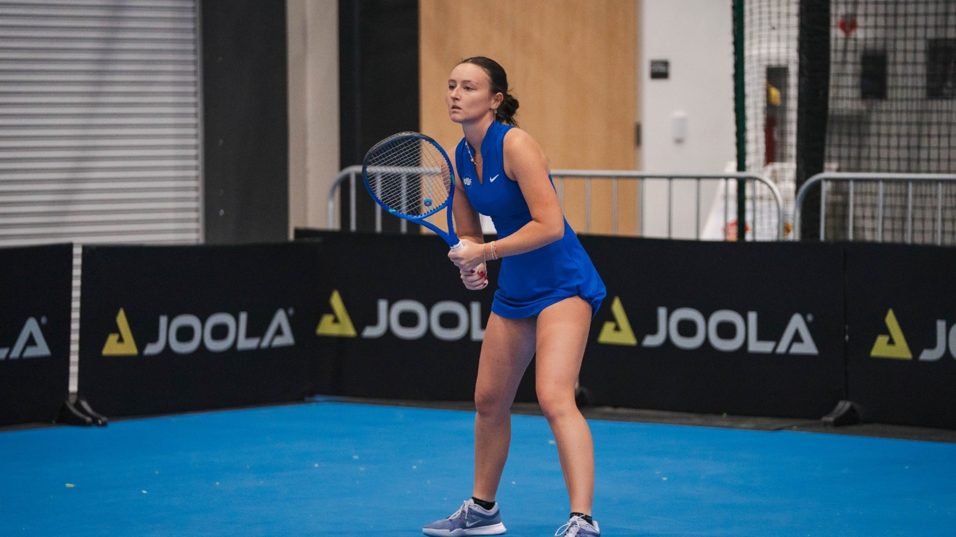 Kylie Kochis waiting to receive a serve