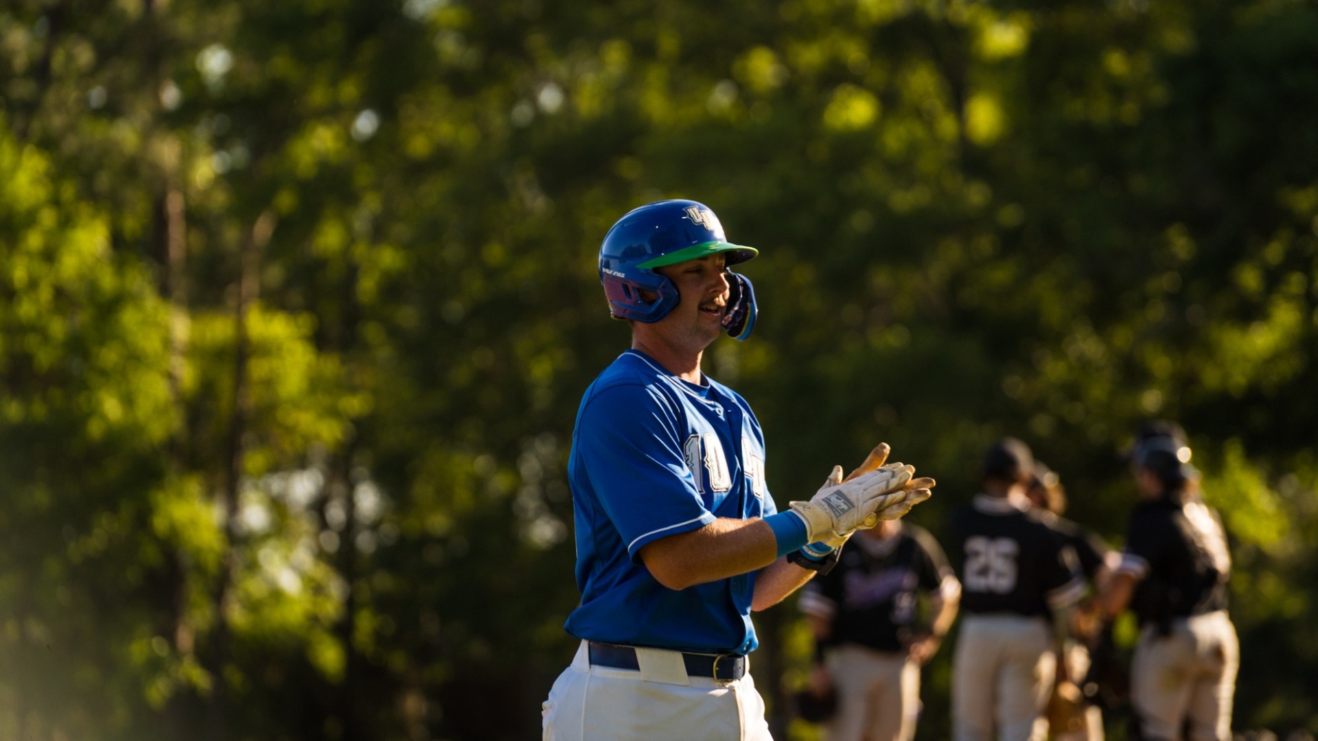 Tanner Taylor clapping on base