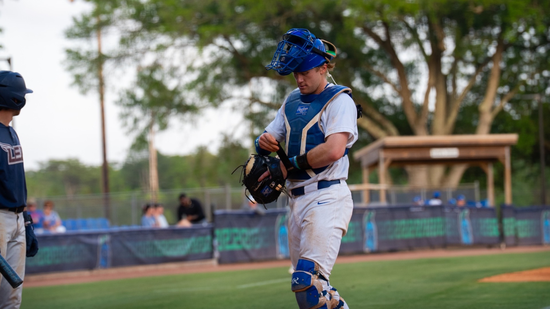 William Lybrook walking back behind the plate to catch