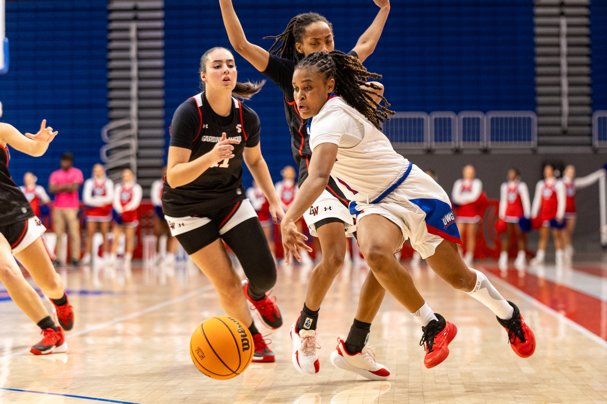 WBB vs Gardner-Webb | Nov 8, 2025 
Sydne Tolbert drives to basket while wearing white uniform.