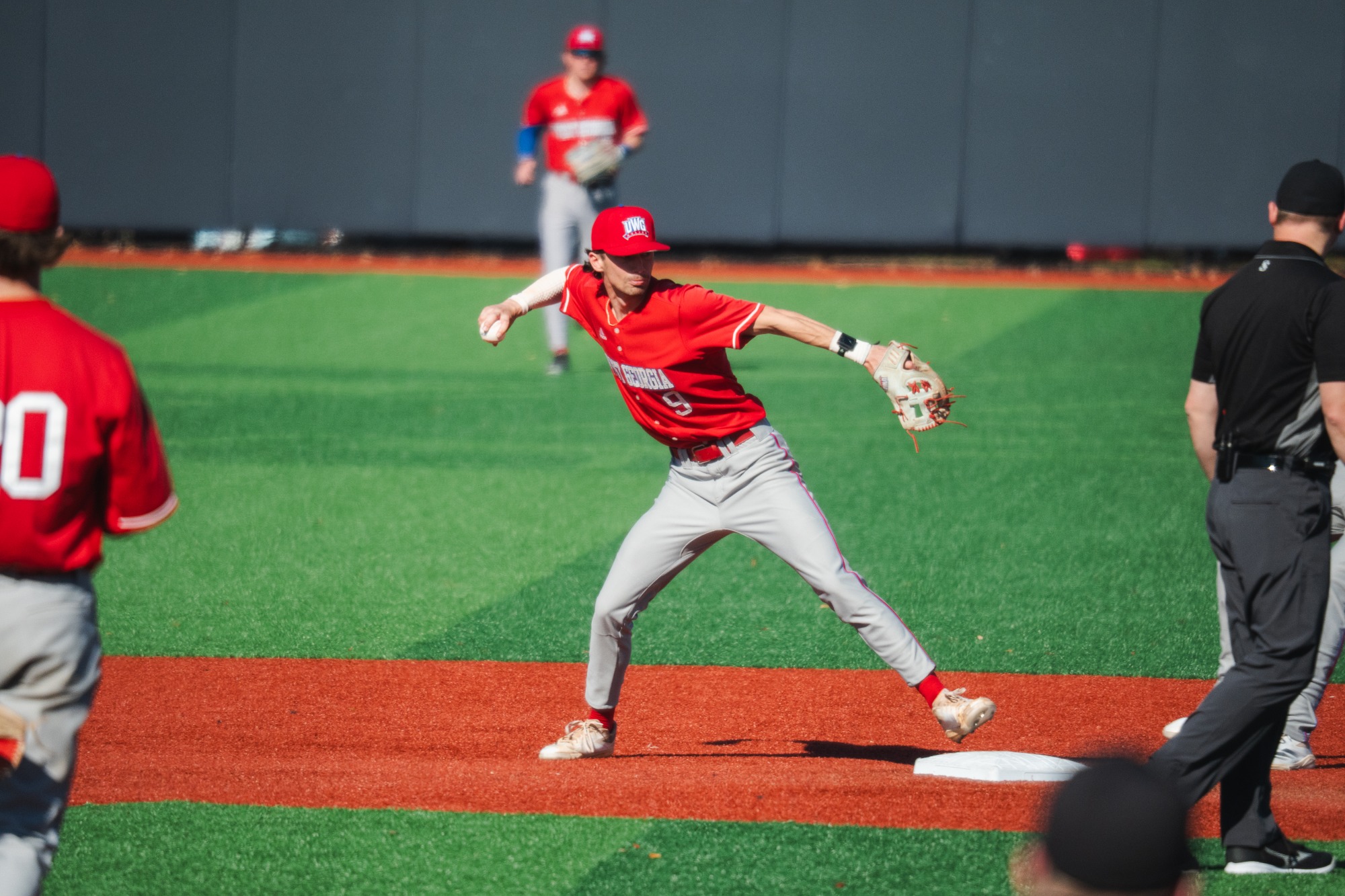 Jacob Bowman tagging second base and throwing to first to try to get a double play vs South Alabama 