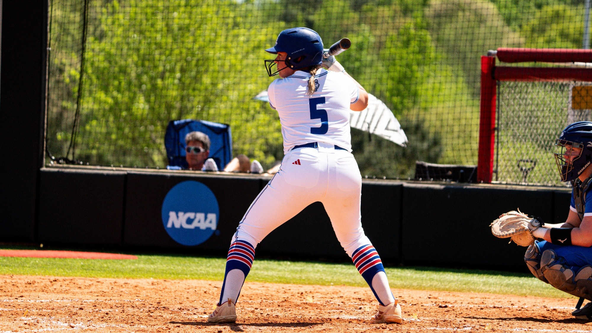 Jenna Samuel during at at-bat against FGCU on Saturday, April 11. She is wearing an all-white UWG softball uniform.