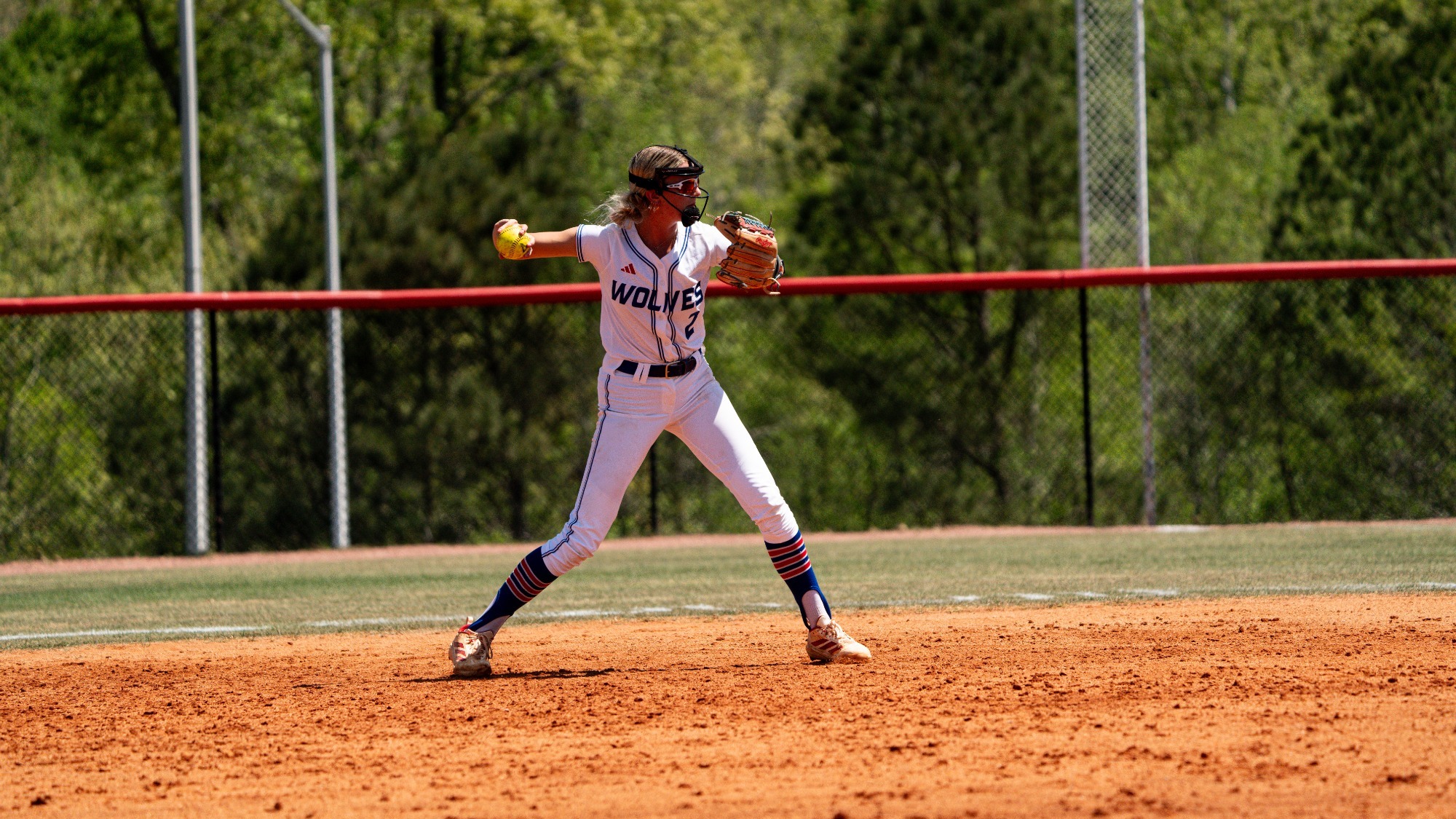 Dixiana Sims throws ball to first in West Georgia Softball Game