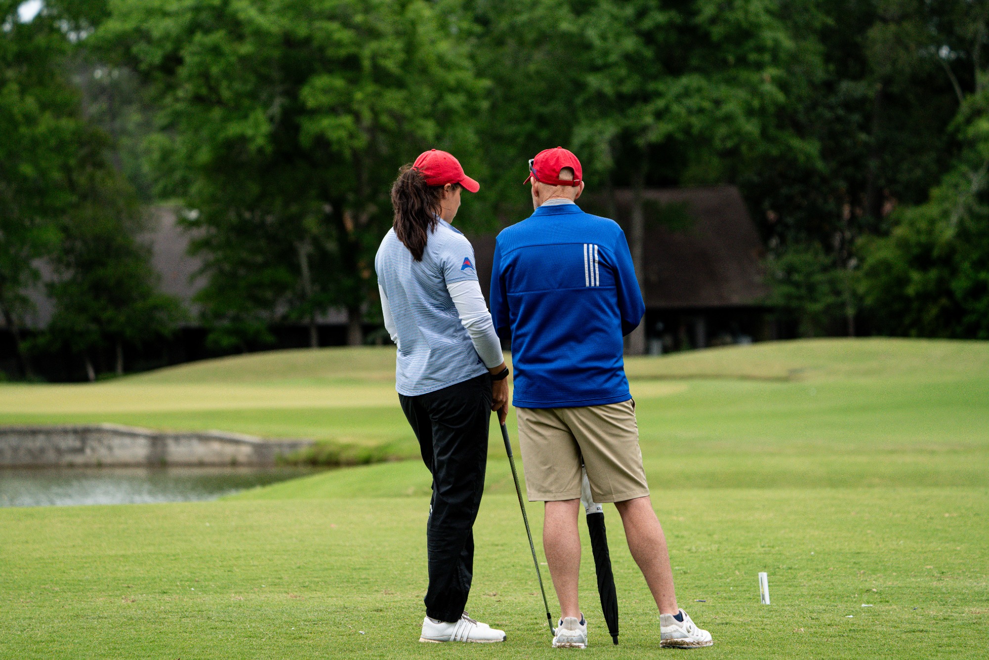 WGO ASUN Championship | Apr 17-19, 2026
UWG female golfer stands with head coach while wearing grey shirt with black pants.