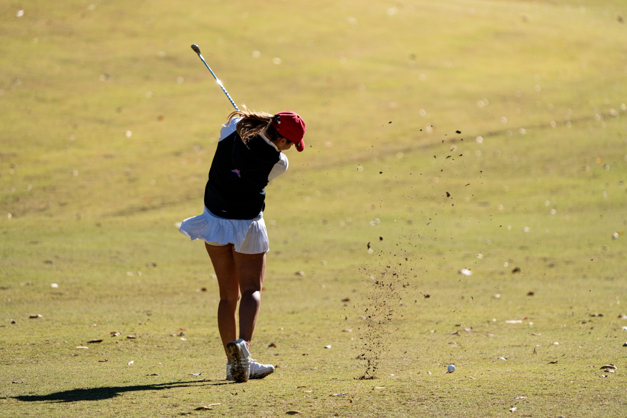 WGO vs Mercer | Nov 2nd, 2025
UWG Female golfer hits ball while wearing black vest with white pants.