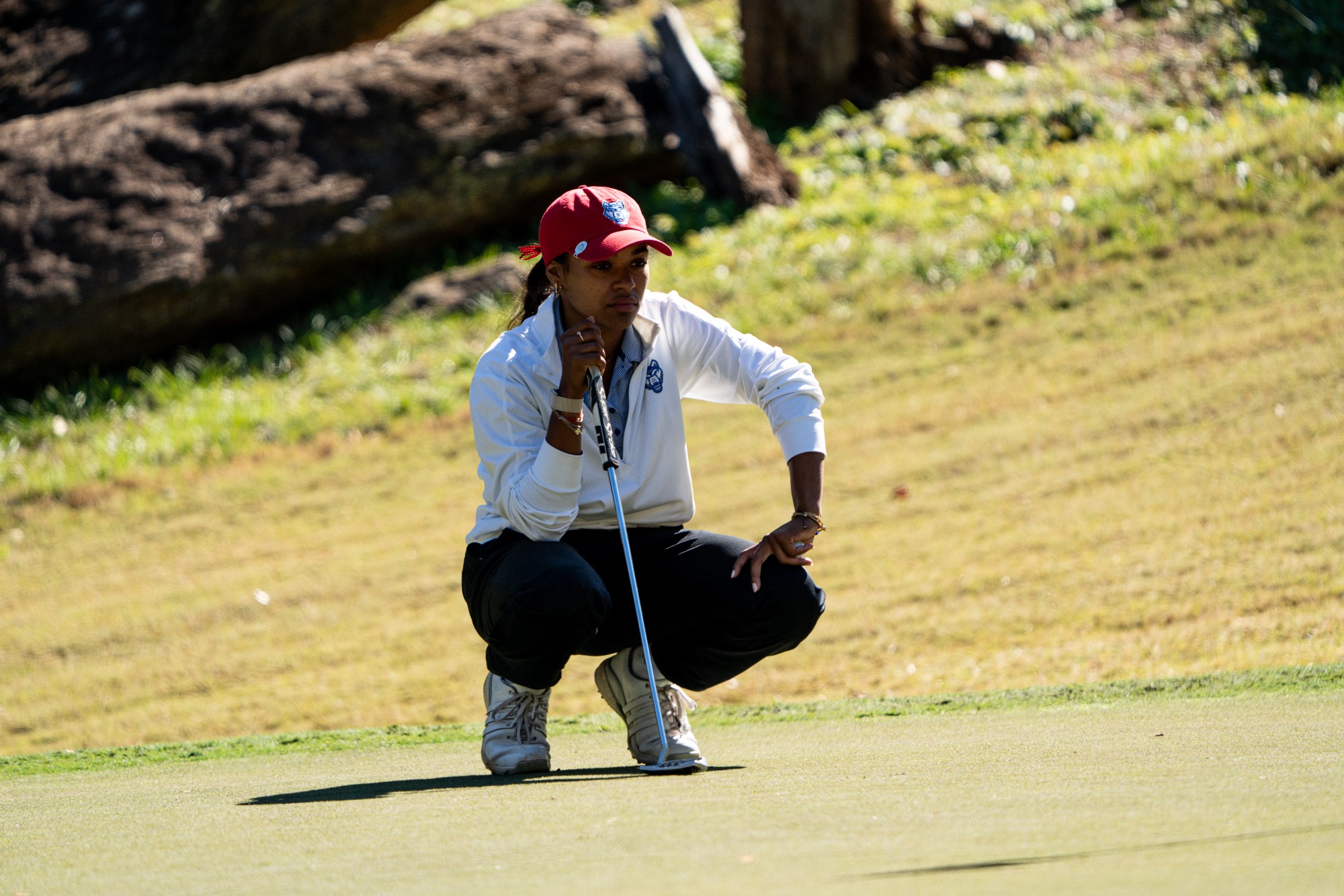 WGO vs Mercer | Nov 2nd, 2025
UWG Female golfer watches ball wearing white jacket with black pants.